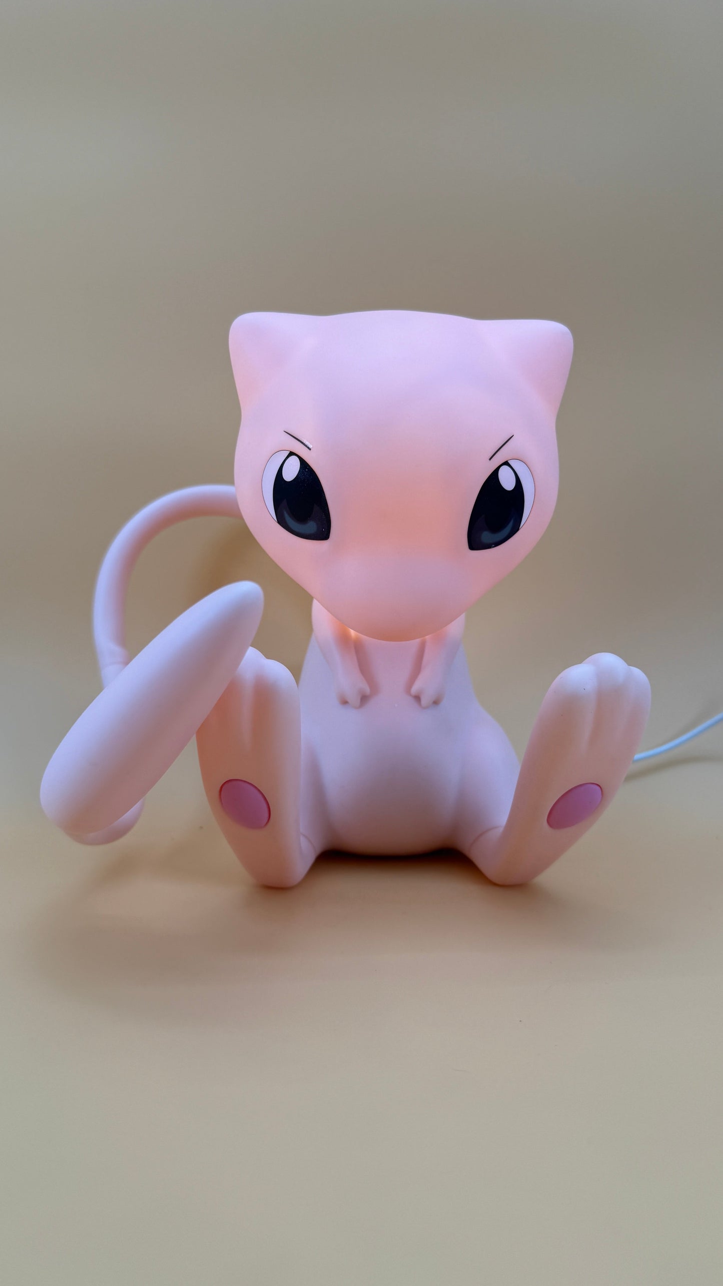 7.5” Mew desk lamp with movable tail and USB cord.