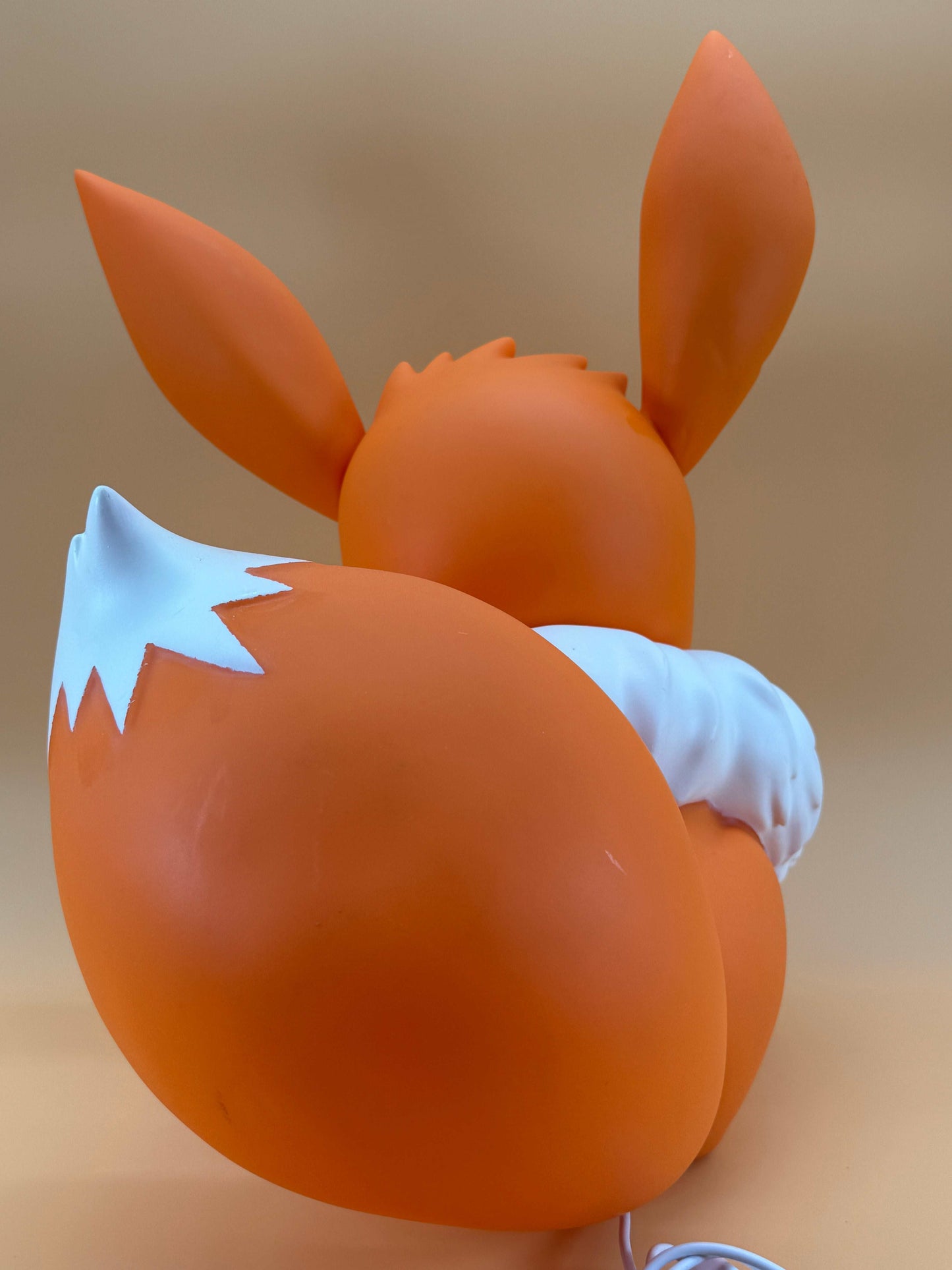 14.5" Eevee large statue desk lamp with USB, rear view, orange color.