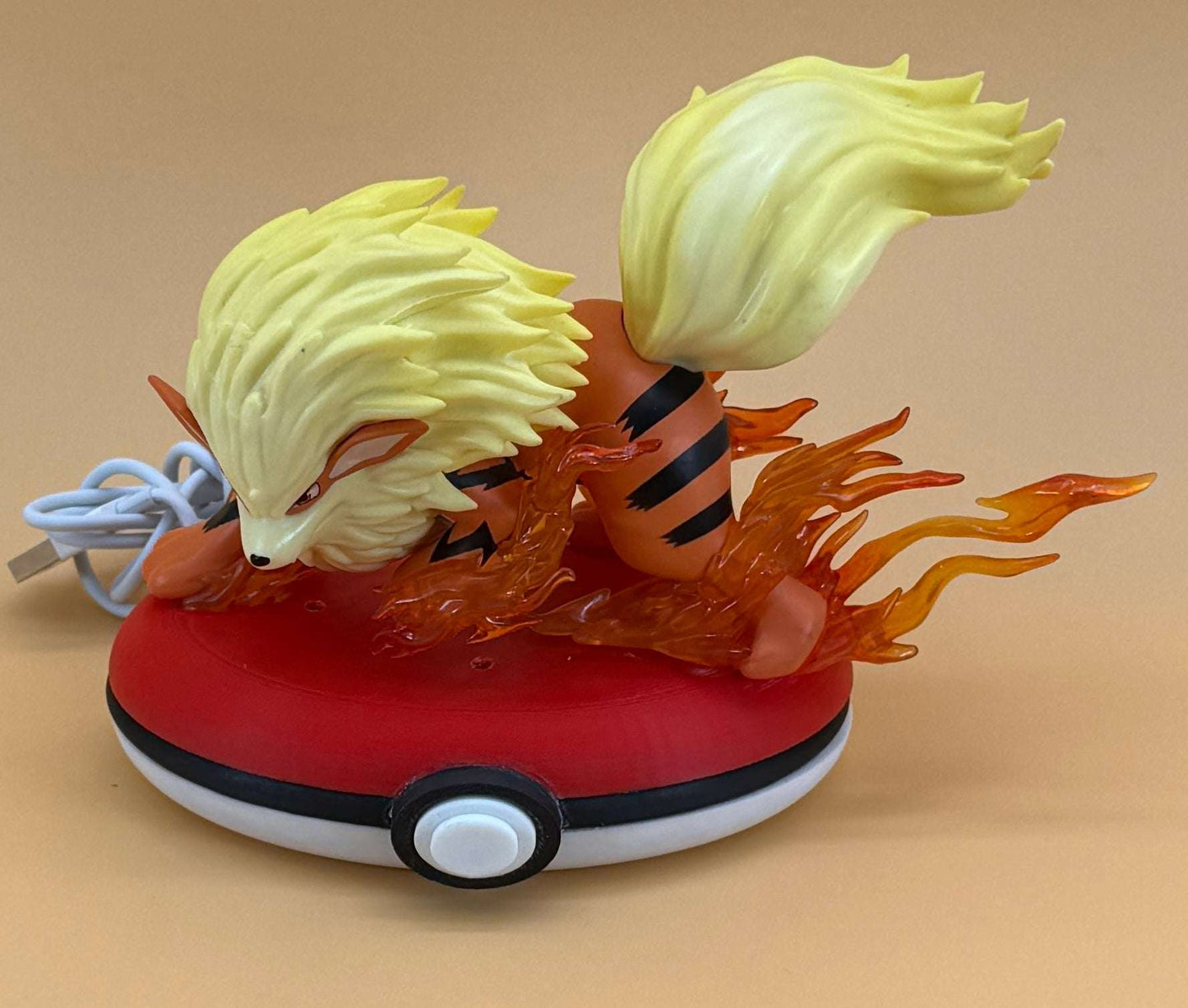 Arcanine Pokeball Stand Desk Lamp with USB, featuring a detailed statue and flame design.