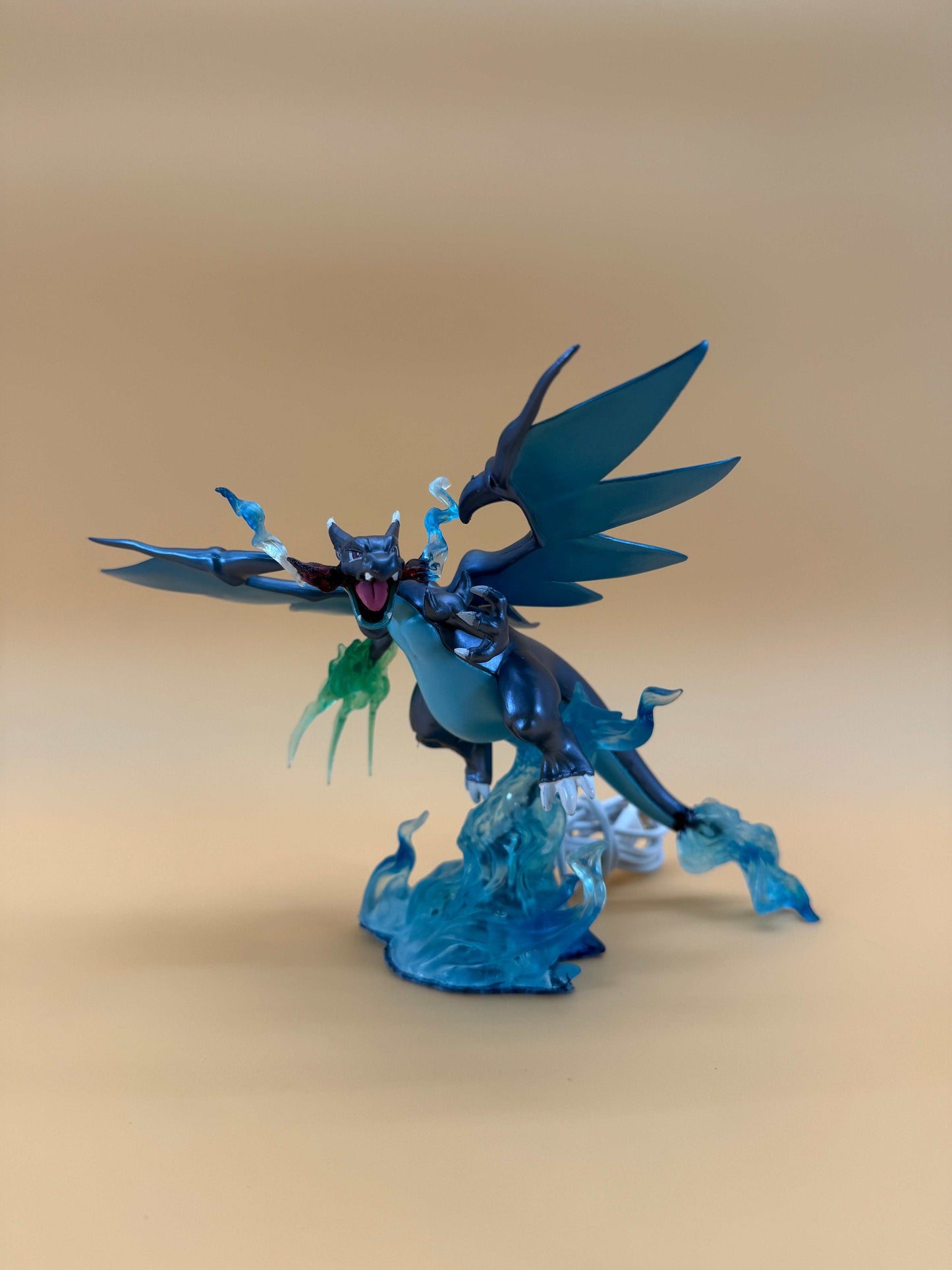 Mega Charizard X Pokemon statue USB desk lamp with built-in cord.
