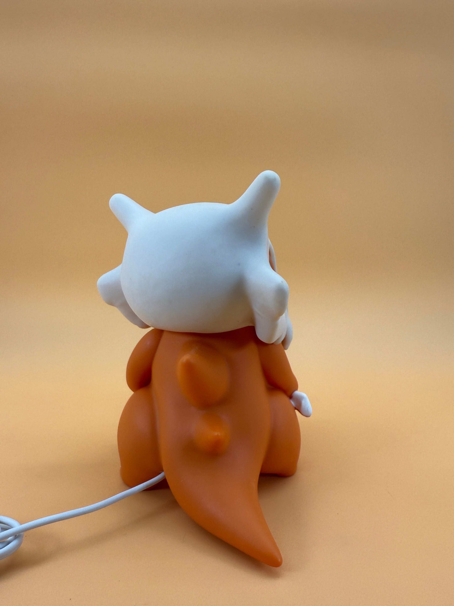6" Cubone Pokemon statue USB desk lamp with built-in cord, unique and magical design.