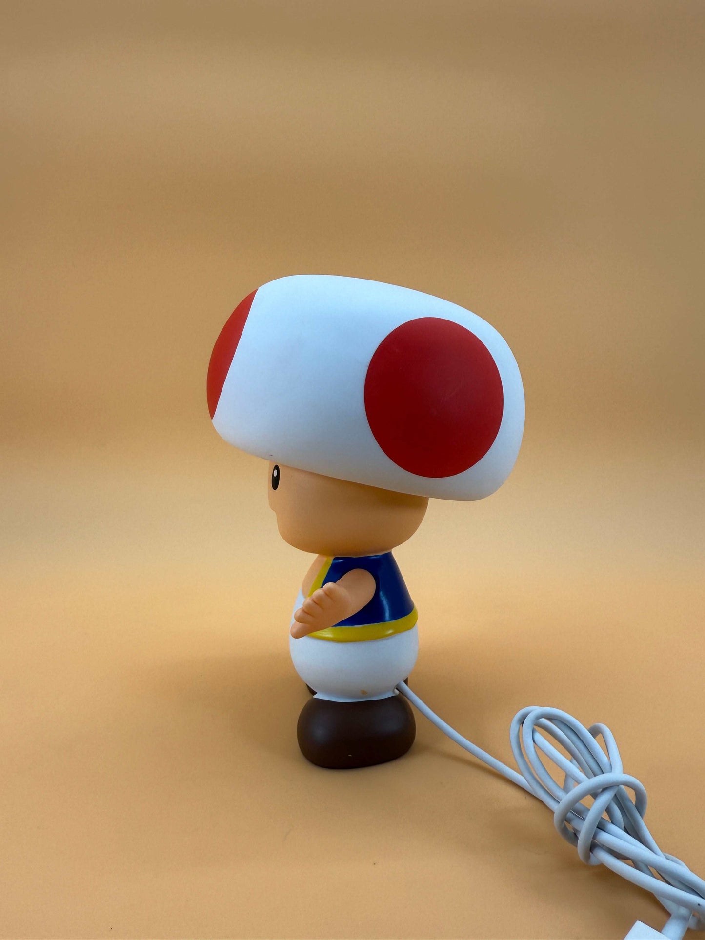6" Nintendo Toad Statue USB Desk Lamp with built-in cord, side view.