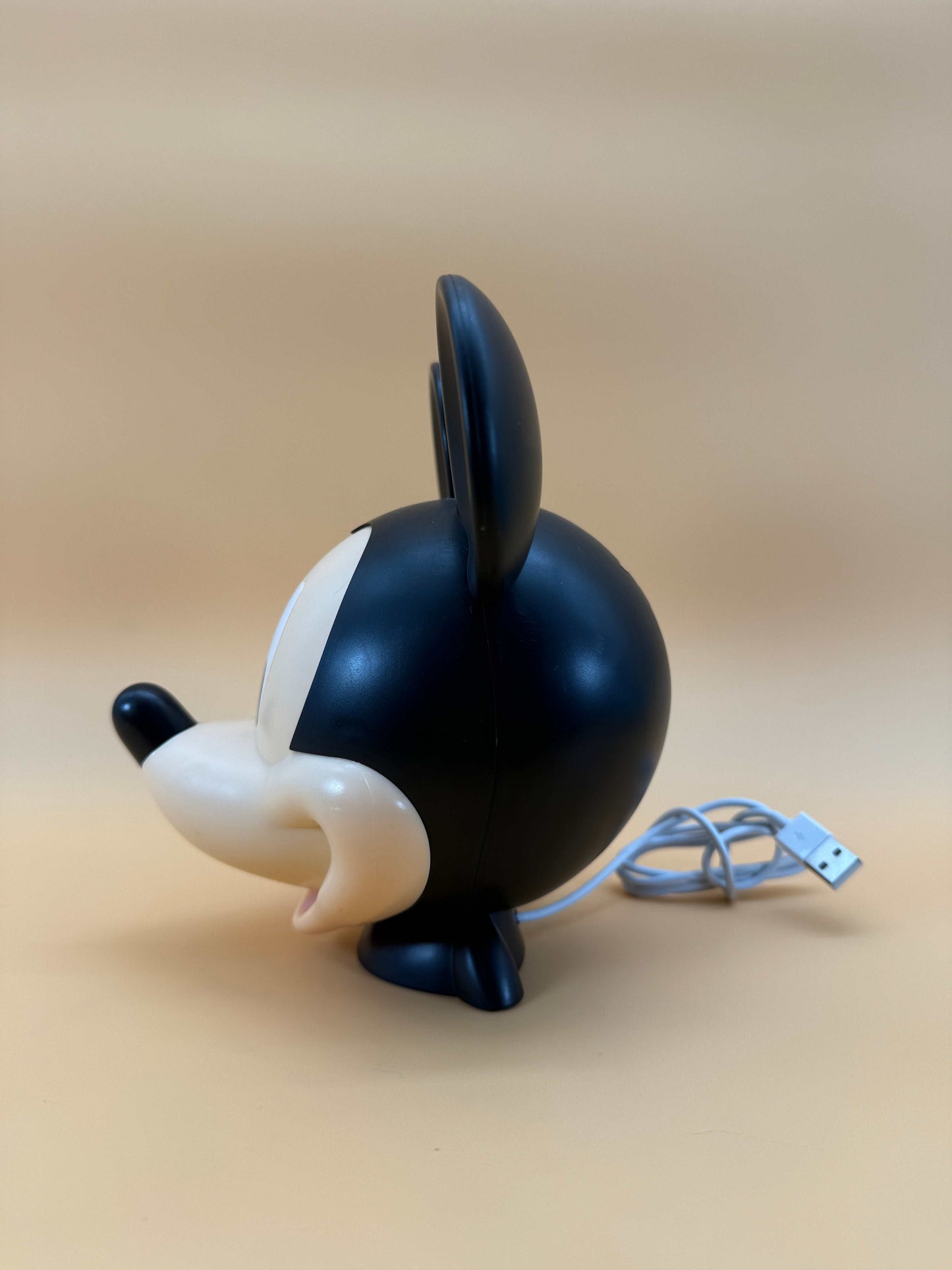 6" Disney Mickey Mouse statue USB desk lamp with built-in cord, side view.