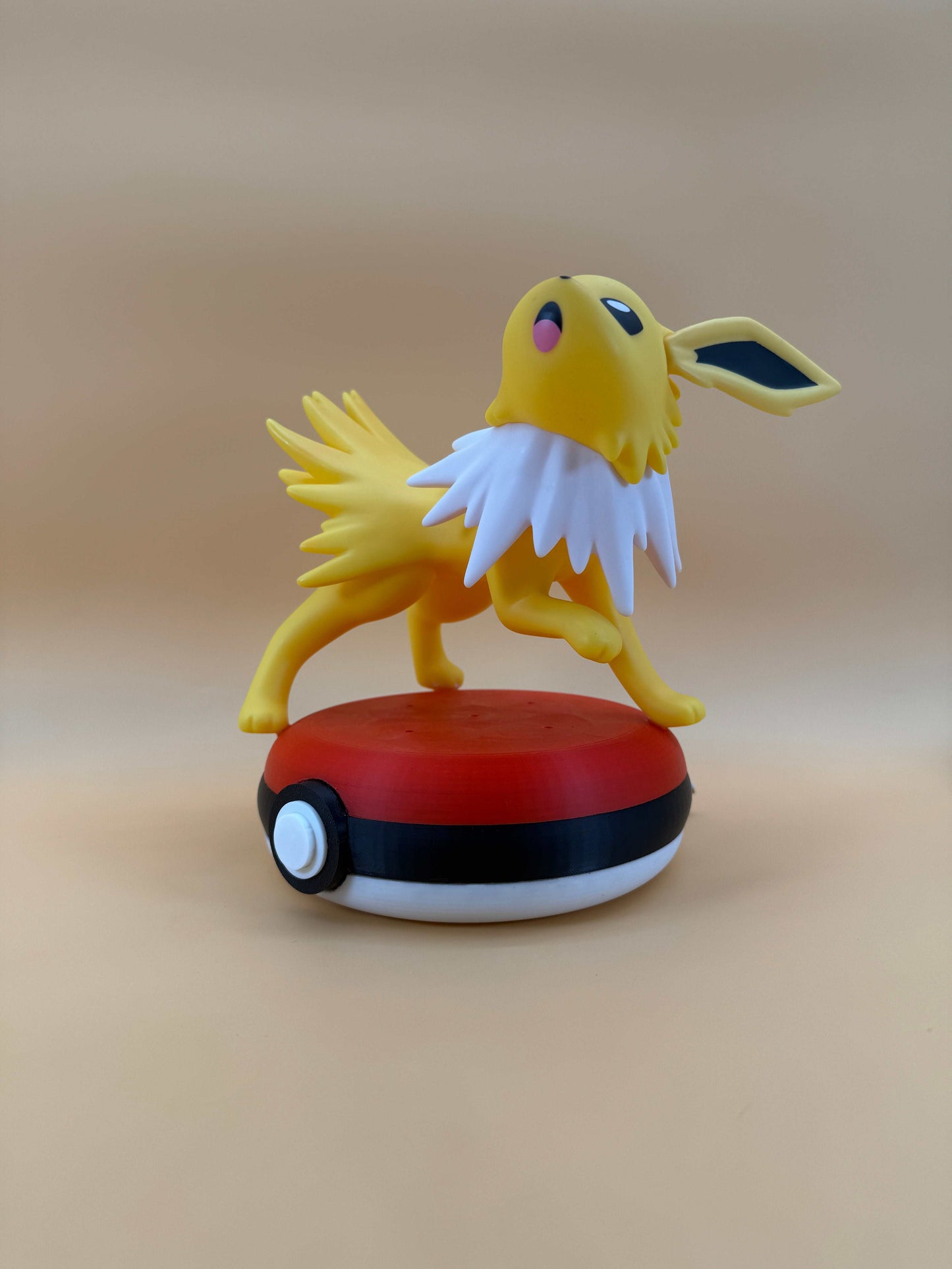 Jolteon Pokeball Desk Lamp with USB cord, 7-inch collectible figurine on a Pokeball base, perfect for enhancing your space.