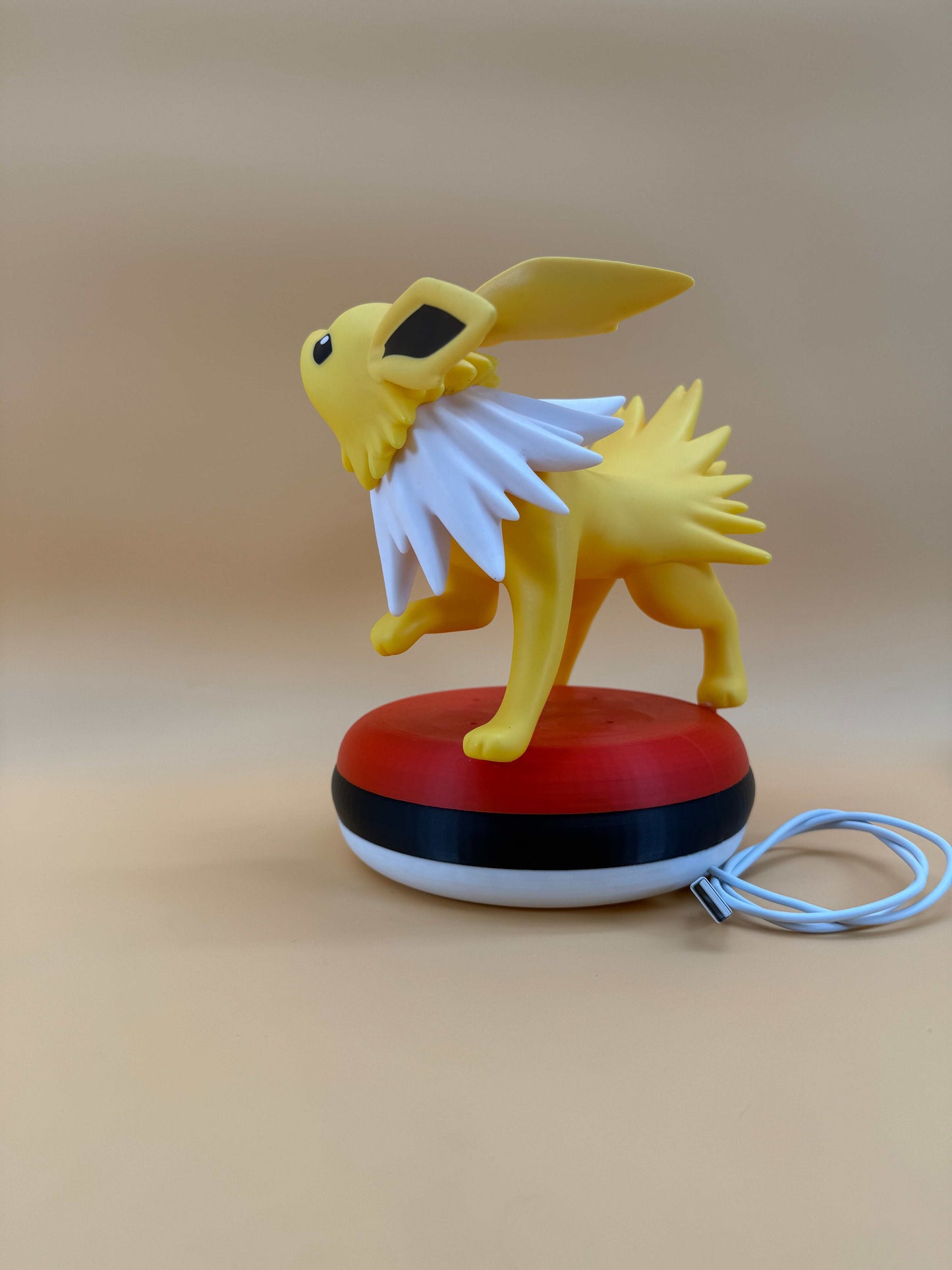 Jolteon Pokeball desk lamp with built-in USB cord.