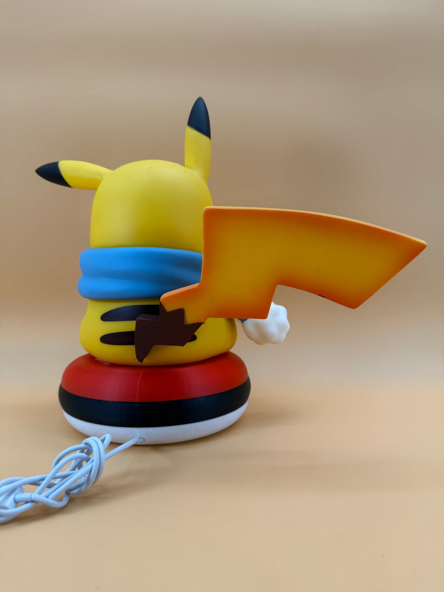 Winter Pikachu Pokeball USB Desk Lamp with scarf and tail design.