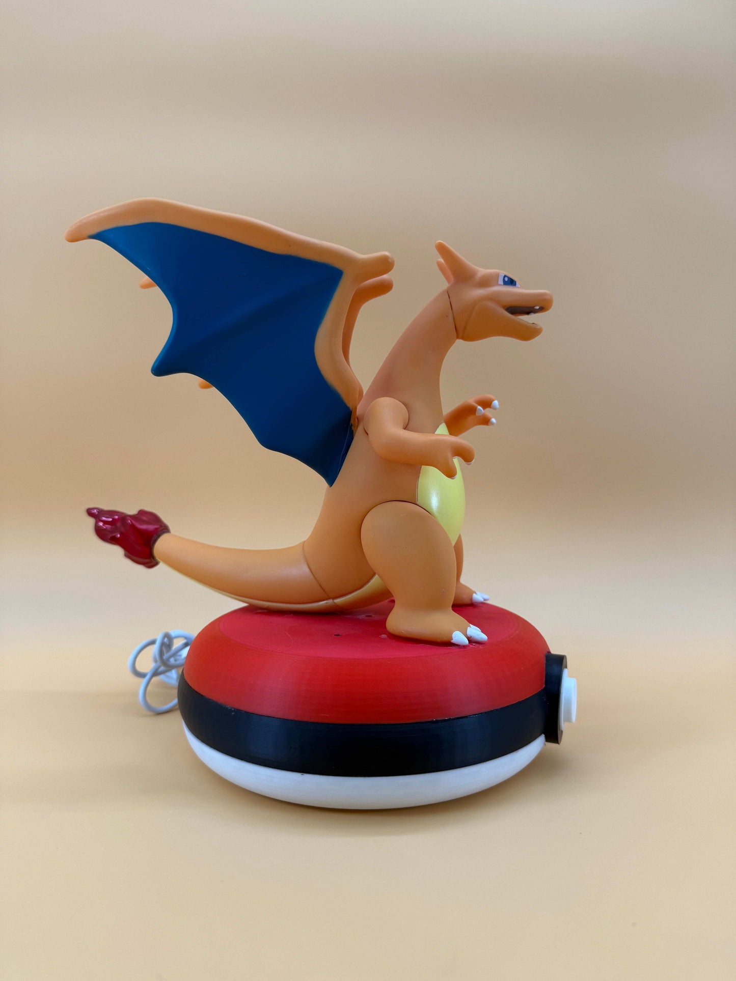 Charizard Pokeball desk lamp with USB cord, 8-inch statue.