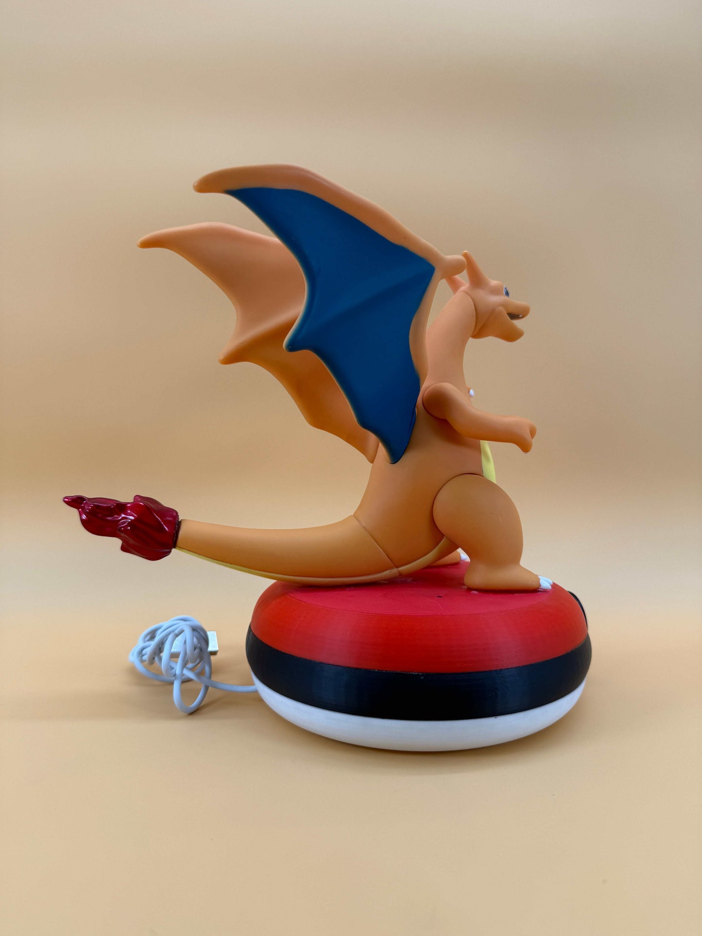 8" Charizard Pokeball USB desk lamp with built-in cord, functional art for unique decor.