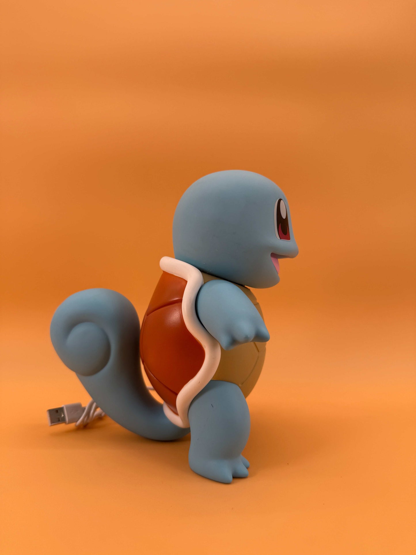 7.8" Squirtle Statue USB Desk Lamp on orange background