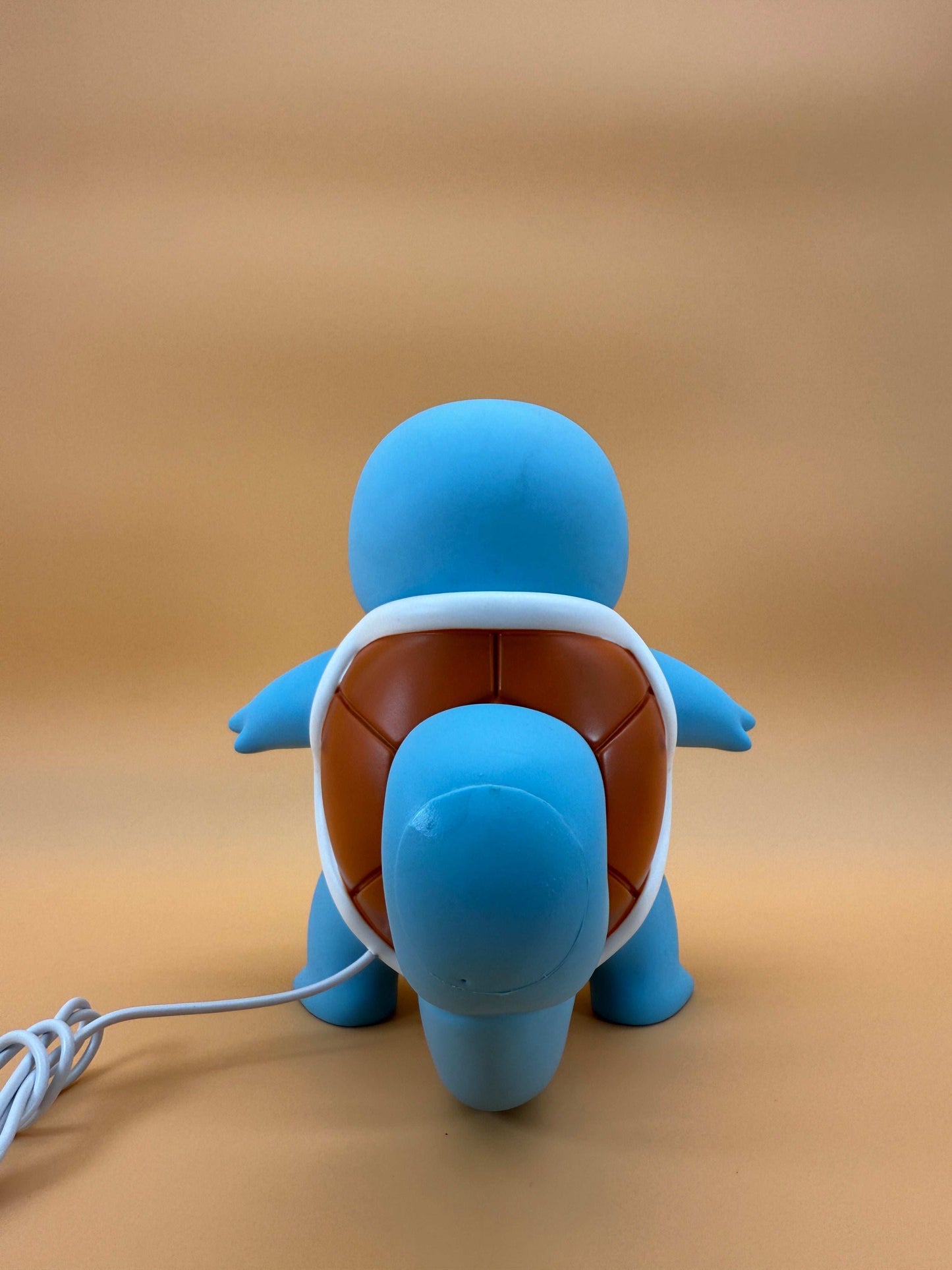 7.8" Squirtle Statue USB desk lamp light showing the back view with integrated cord.