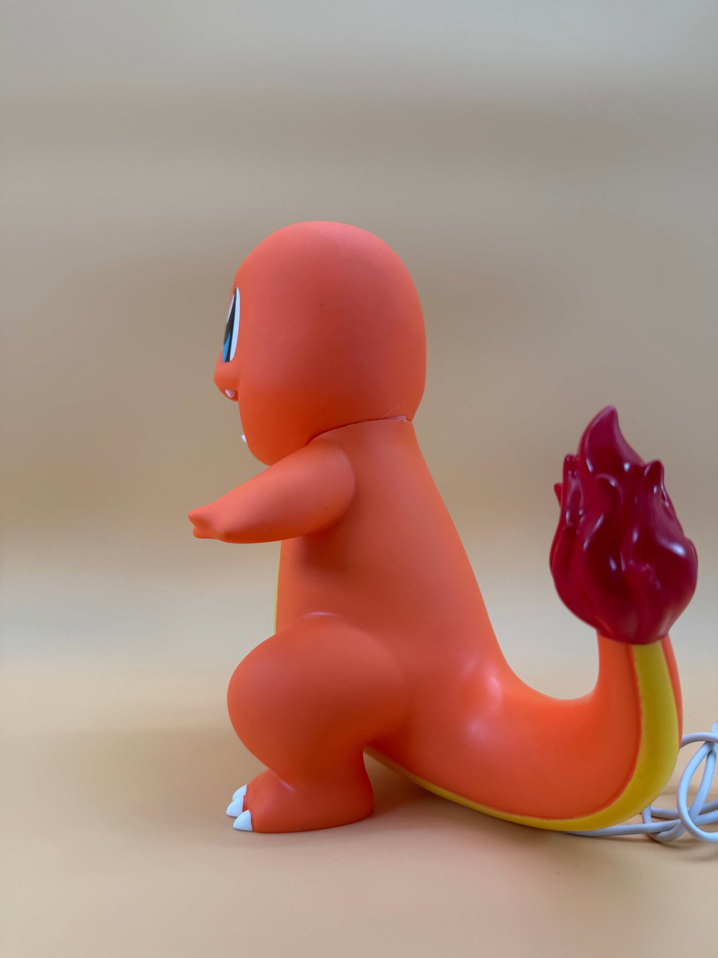 9" Charmander statue USB desk lamp with built-in cord and vibrant design.