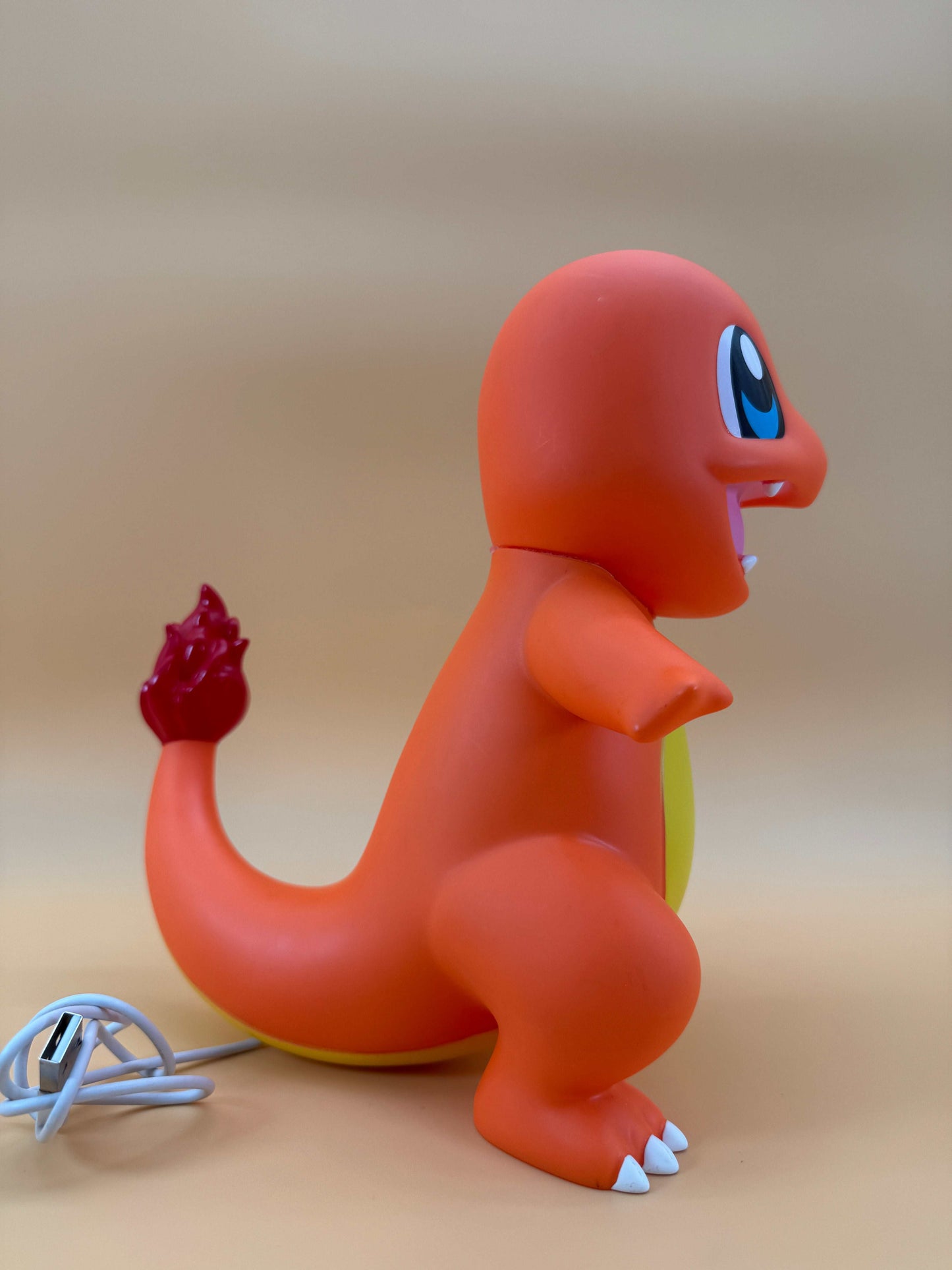 9" Charmander Statue USB desk lamp in vibrant orange with built-in USB cord, perfect for Pokemon fans.