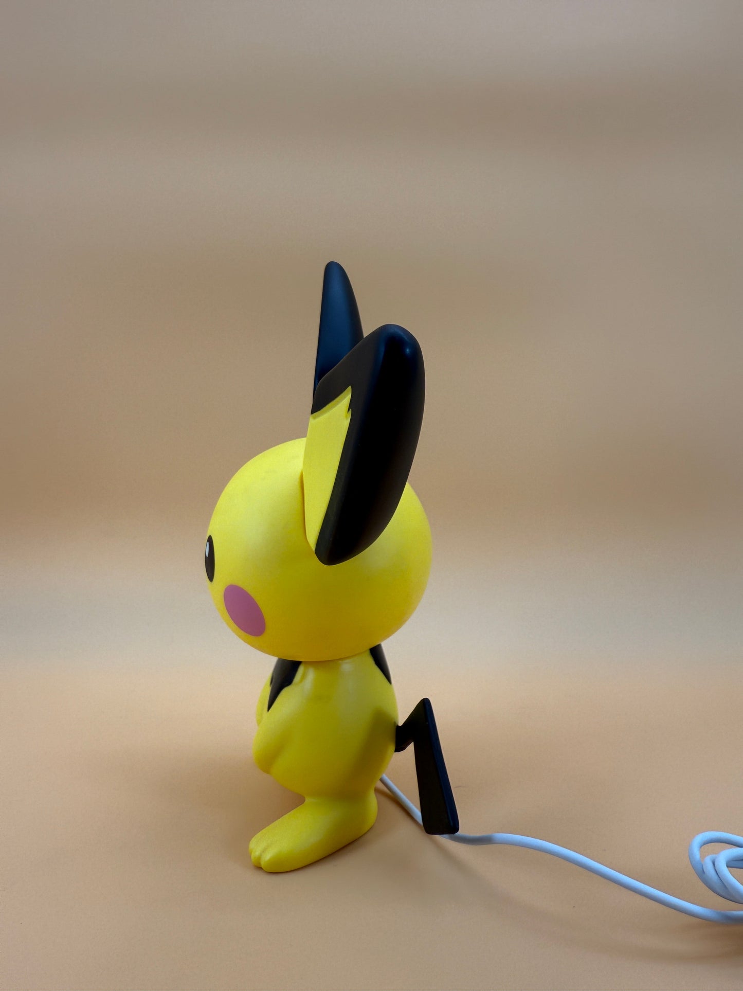 8.5" Pichu Statue Pokemon USB Desk Lamp Light with built-in cord, side view.