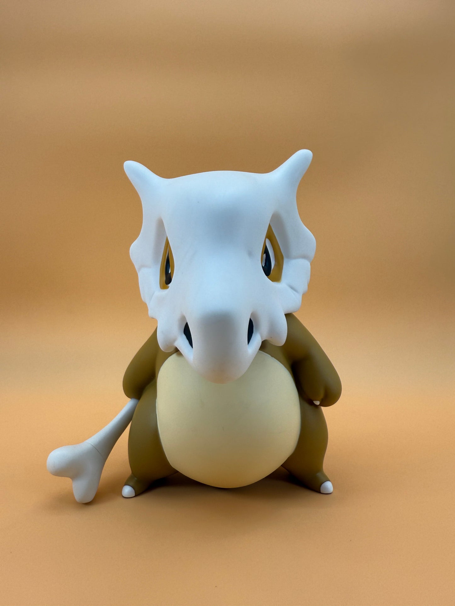 8" Cubone Statue Pokemon USB Desk Lamp Light on a beige background.