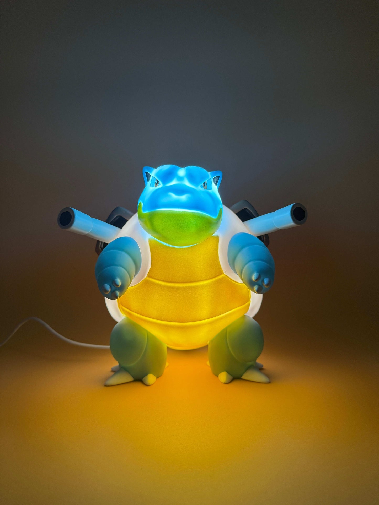 7" Blastoise Statue USB Desk Lamp Light with built-in USB cord, illuminating a space with a magical touch.