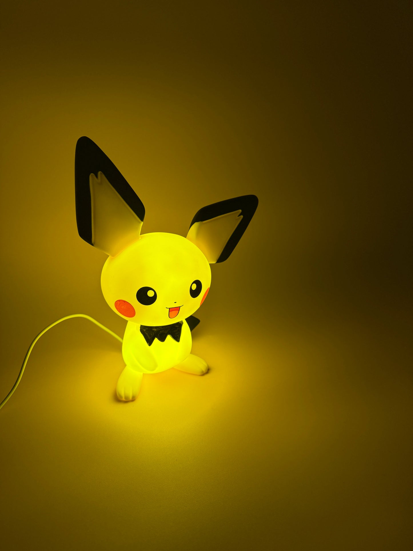 8.5" Pichu Statue USB Desk Lamp Light glowing with built-in cable.