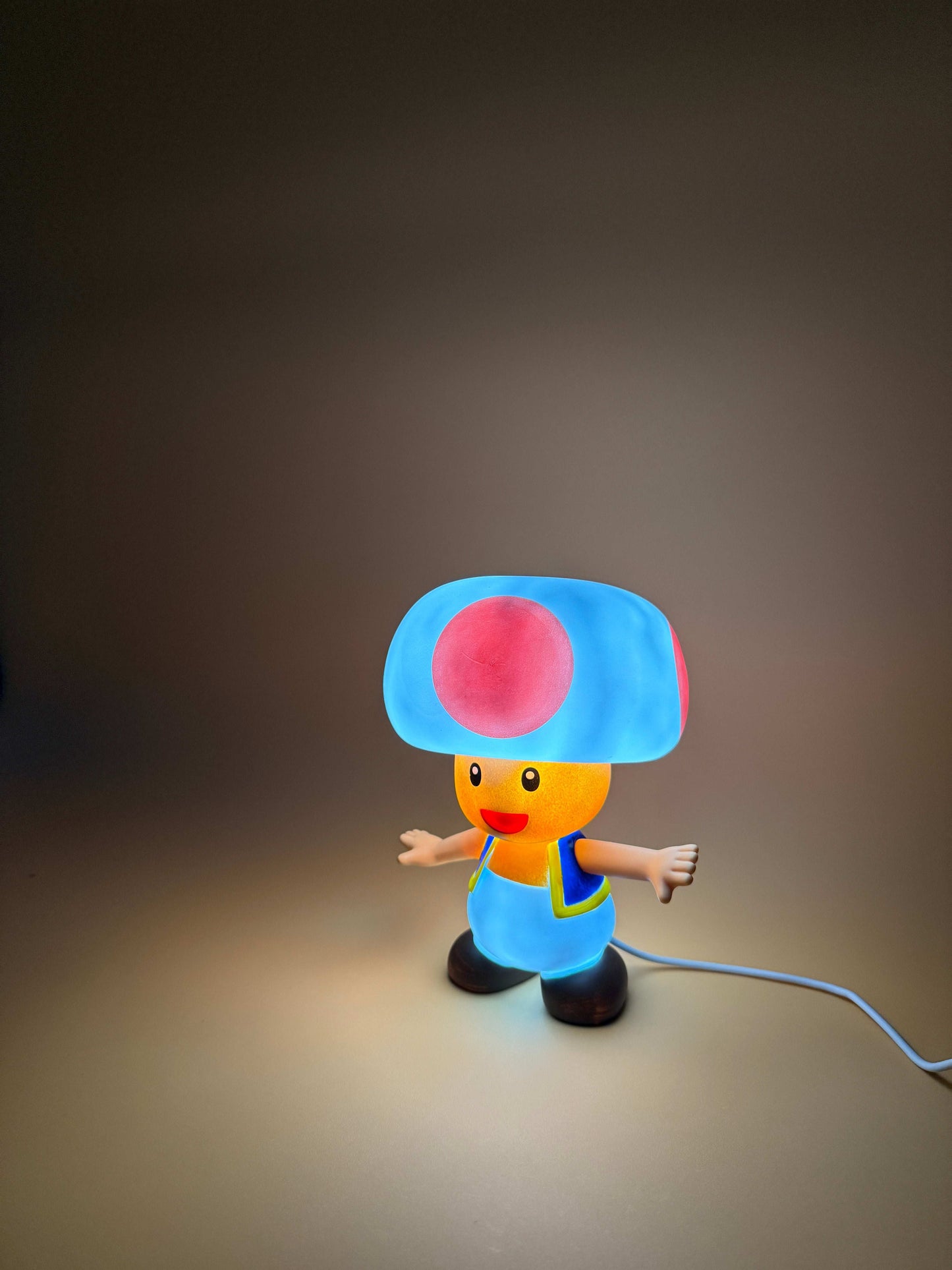 6" Nintendo Toad statue USB desk lamp illuminated.