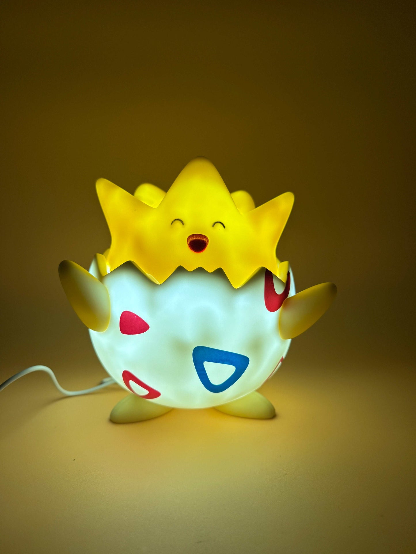 7" Togepi statue desk lamp with USB cord, featuring a glowing Pokémon design.