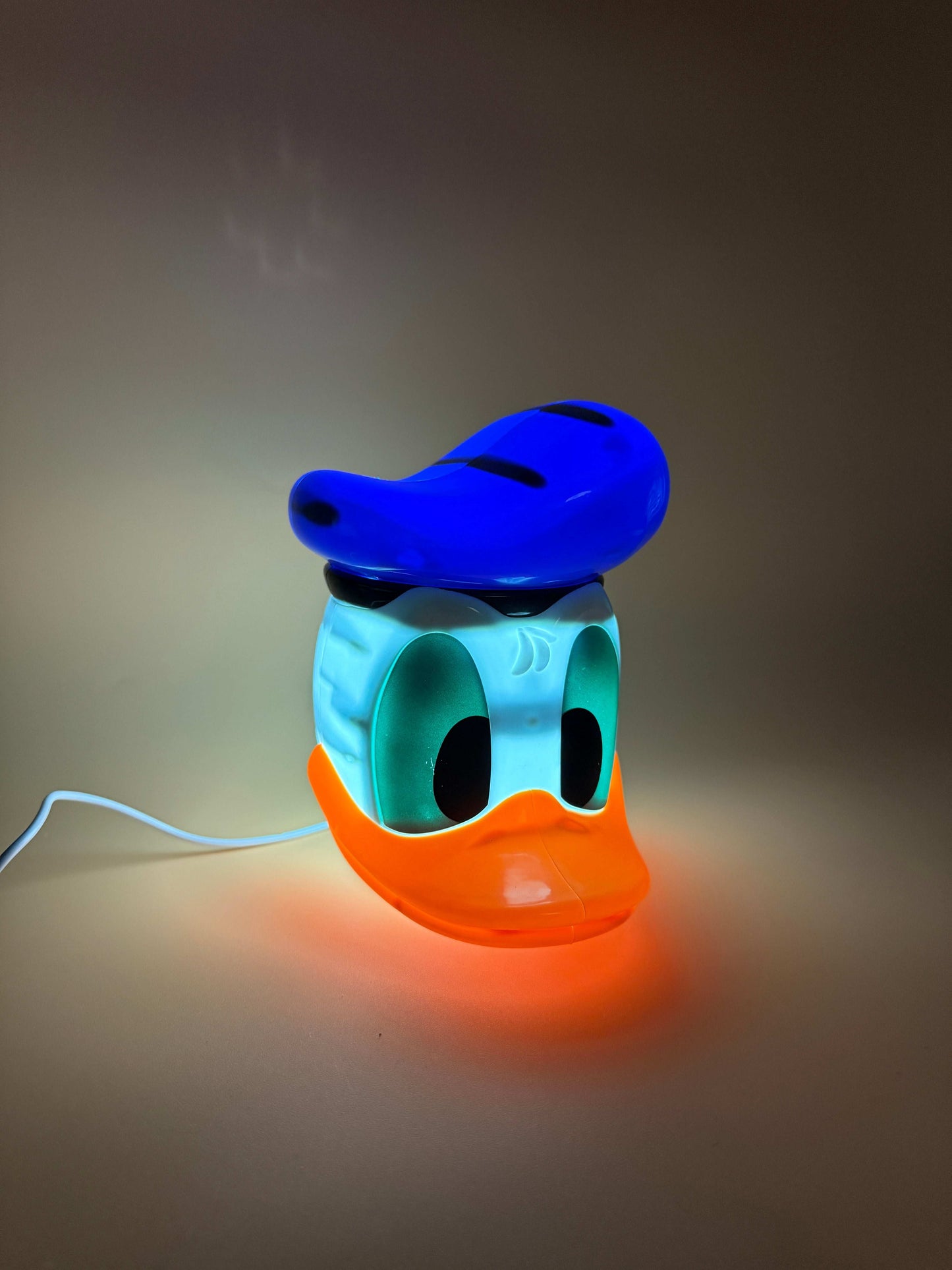 6" Disney Donald Duck statue USB desk lamp with blue hat and orange bill, glowing light.