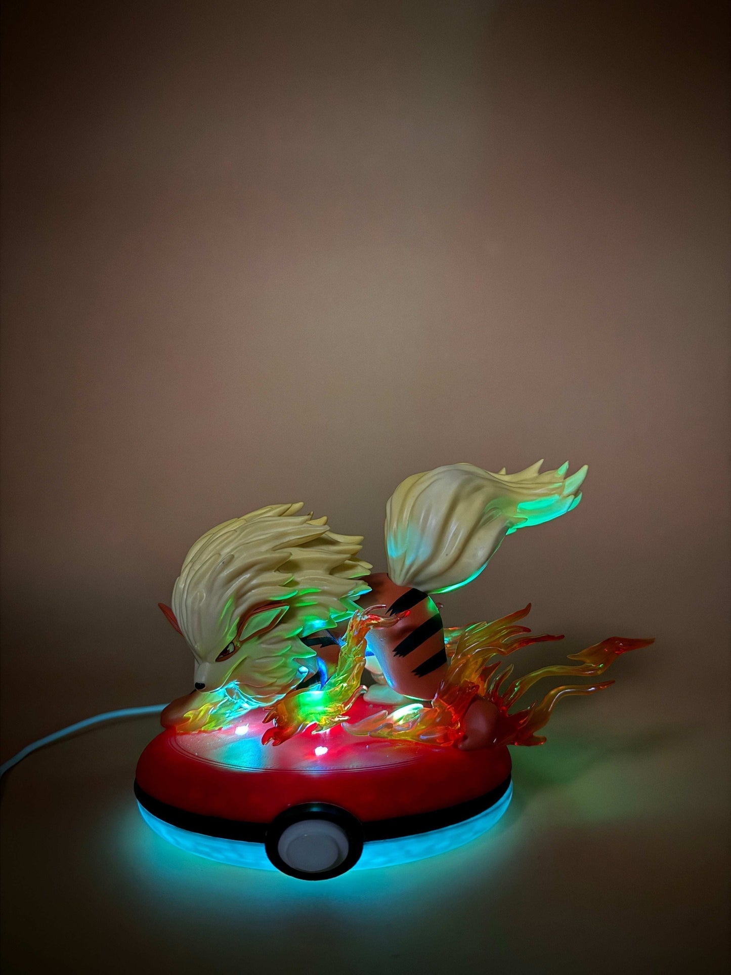 Arcanine Pokeball Stand USB desk lamp with vibrant lights.