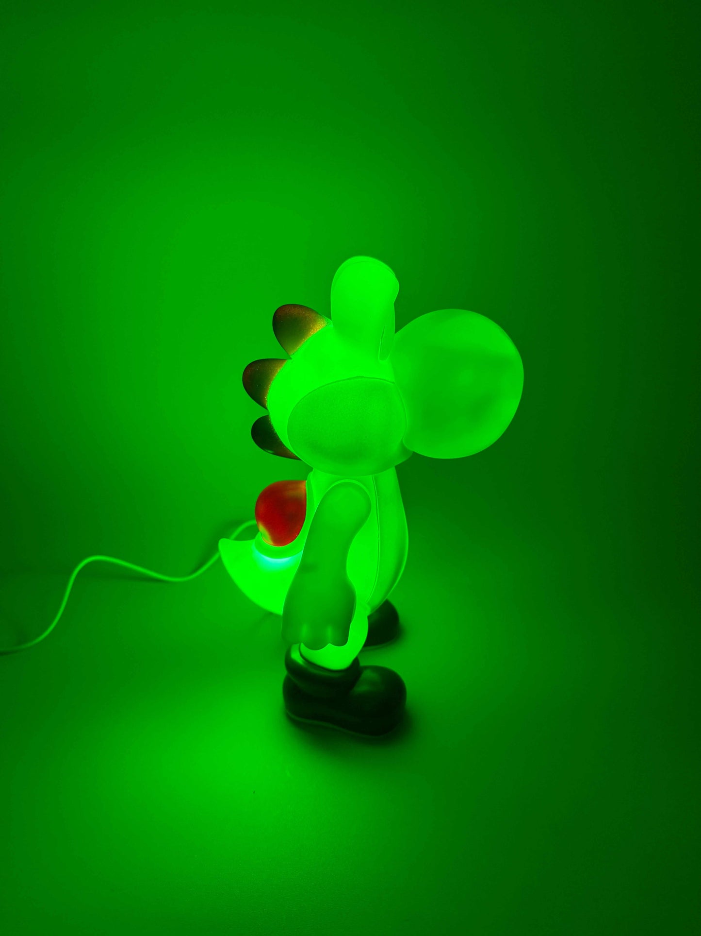 9" Yoshi desk lamp glowing green with built-in USB cord.