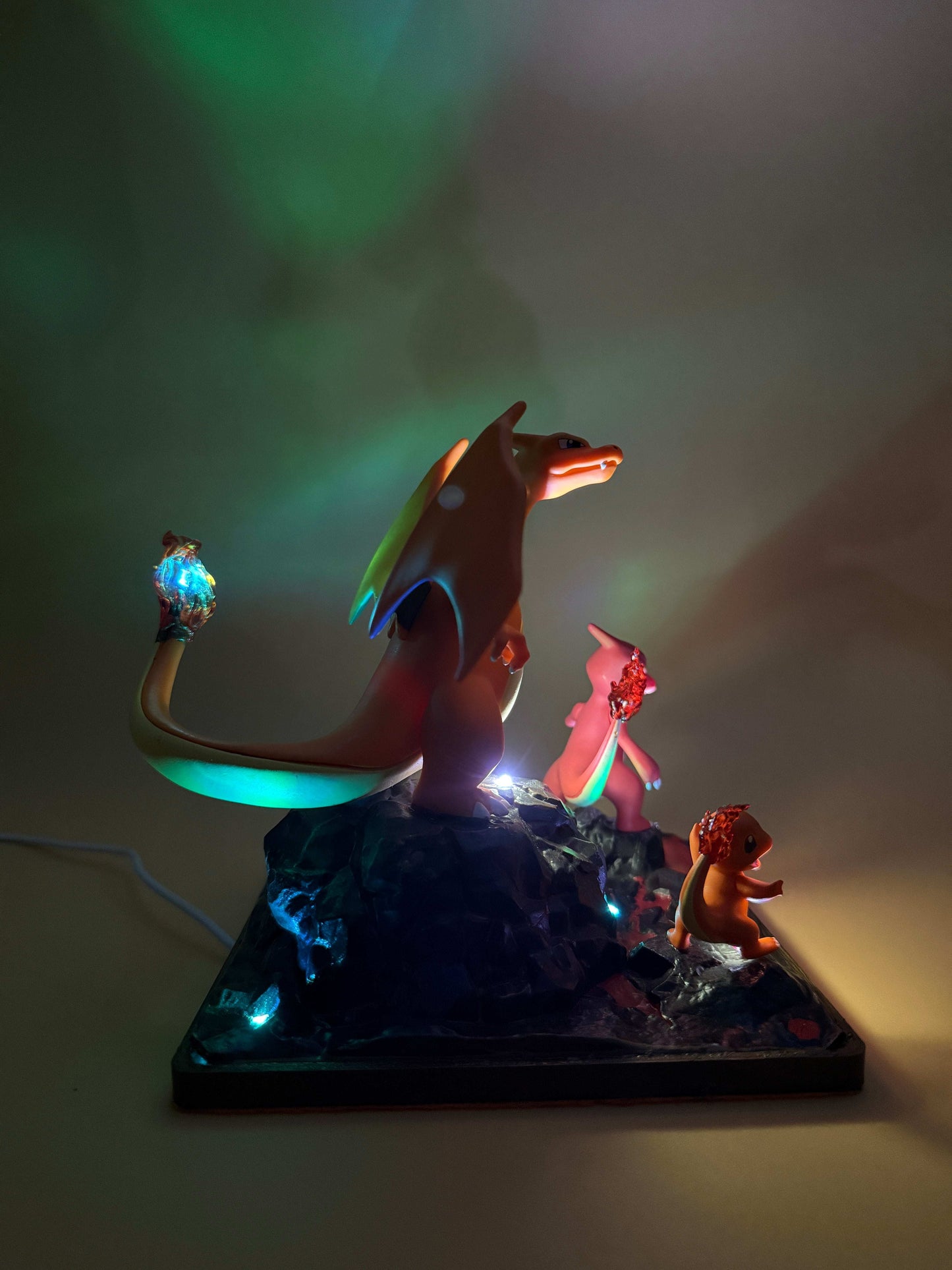6" Charizard Charmeleon Charmander USB desk lamp on a square base, emitting colorful light.