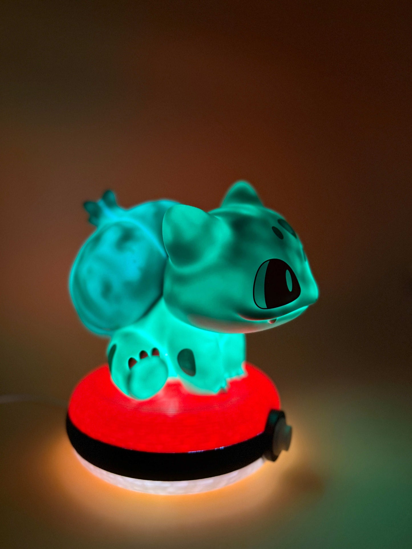 Bulbasaur Pokeball Desk Lamp with USB, glowing green Bulbasaur on Pokeball base.