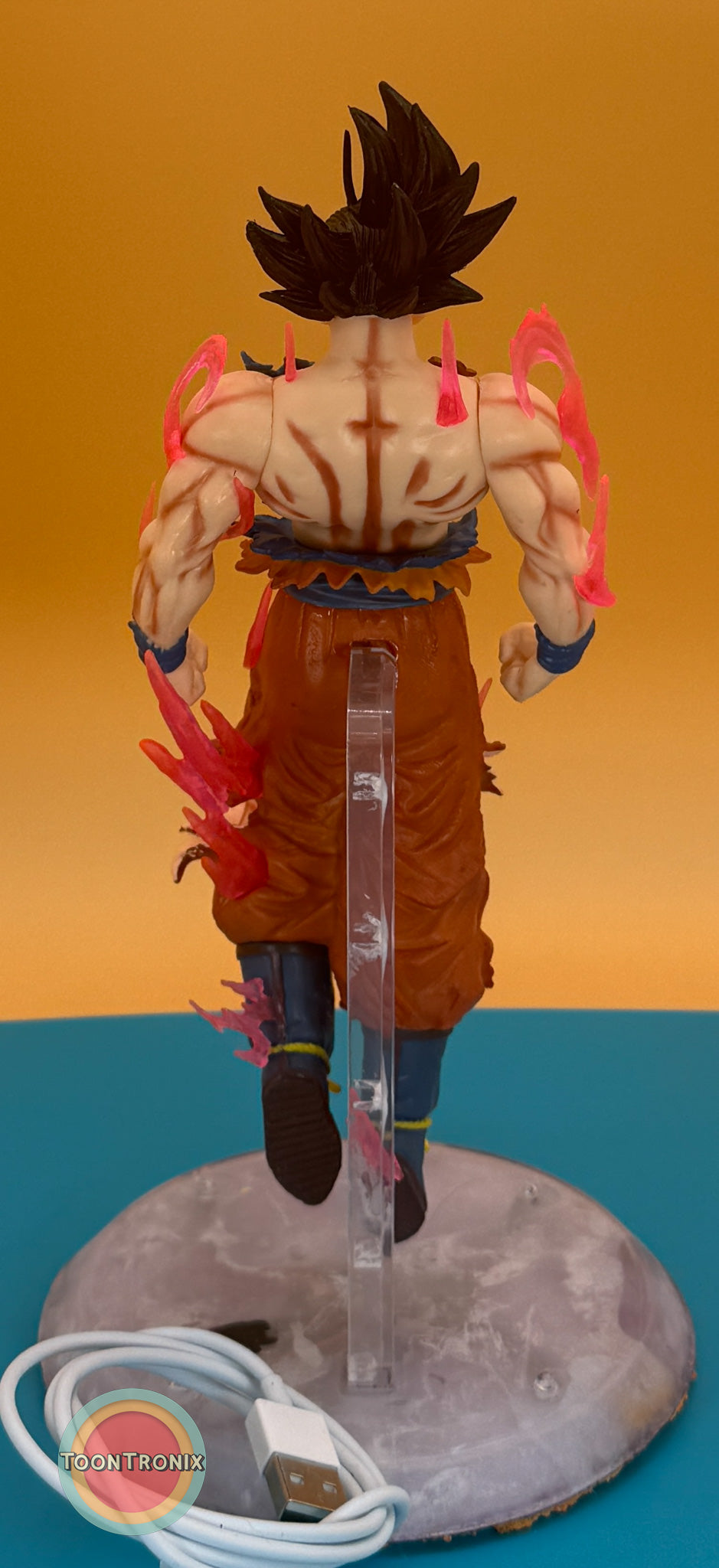 9" Dragonball Z Goku statue USB desk lamp with glowing energy effects and clear stand on a round base