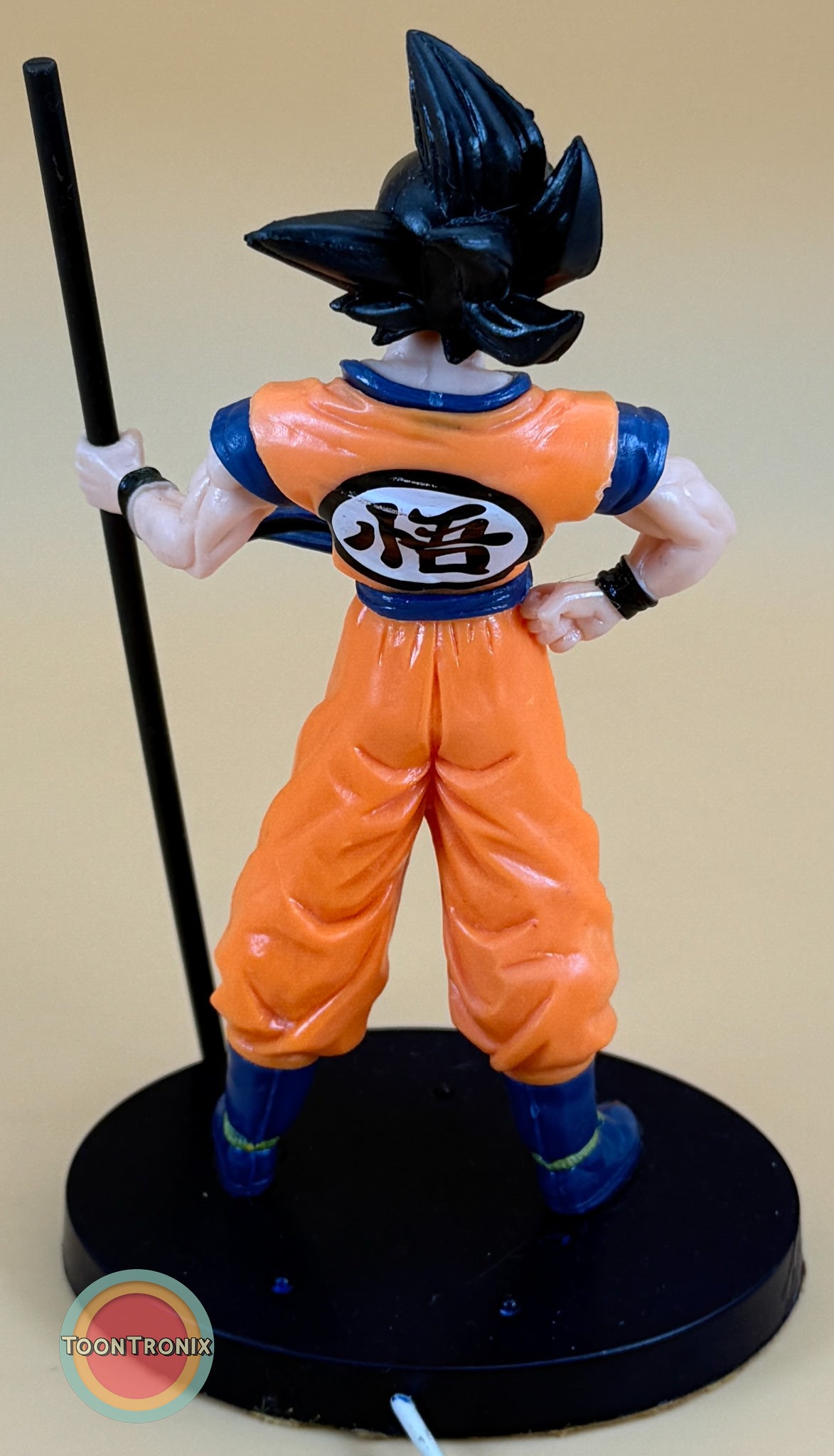 Back view of 8" Dragonball Z Goku Statue desk lamp with USB cord on black base