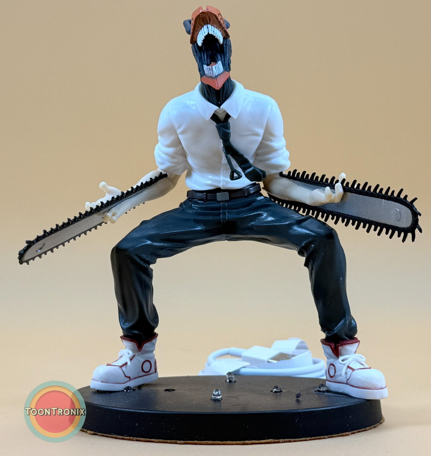 5" Chainsaw Man statue desk lamp with USB cord on black base in dynamic pose