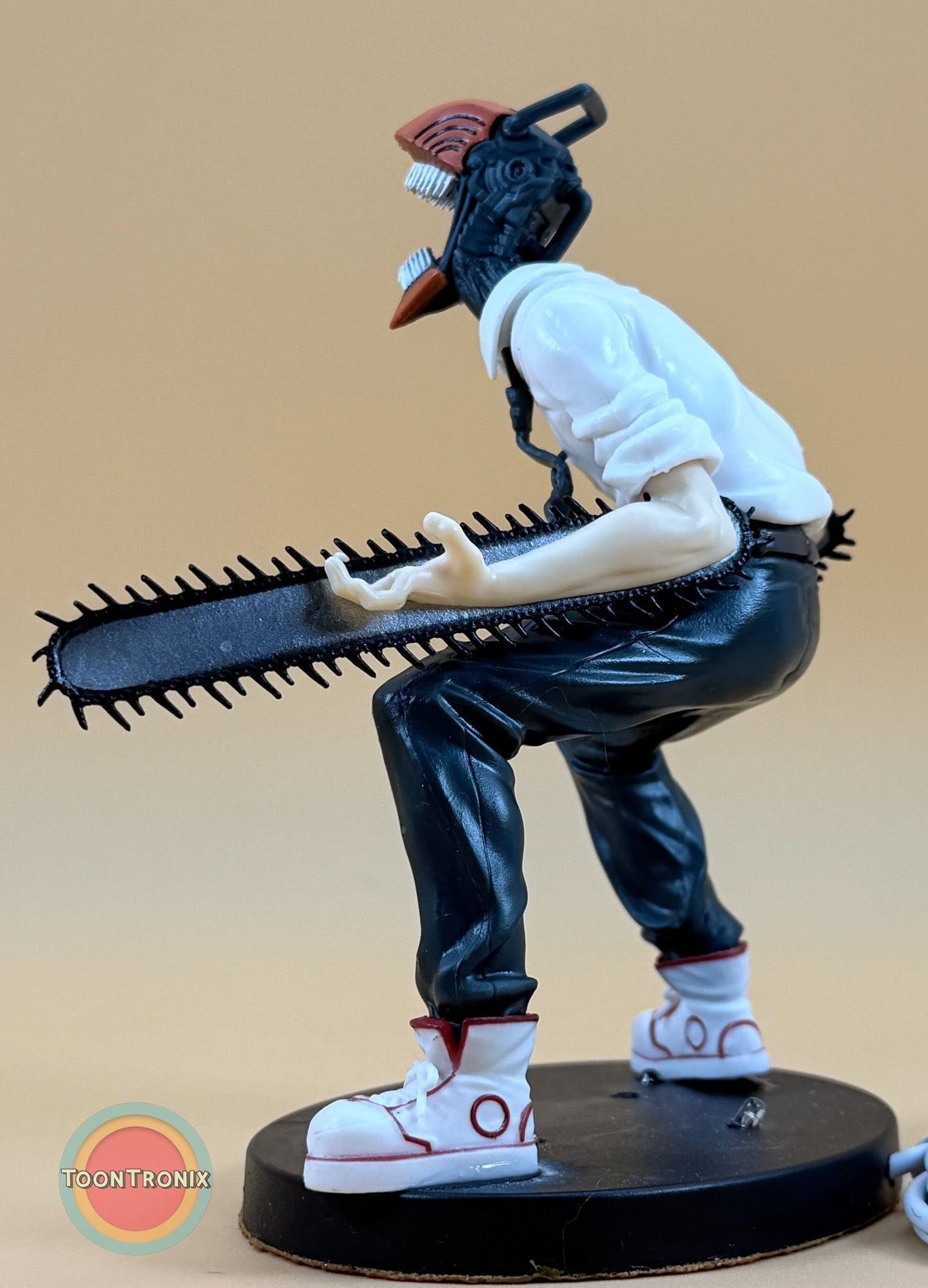 5" Chainsaw Man statue desk lamp with USB cord, detailed figure holding chainsaw on black base