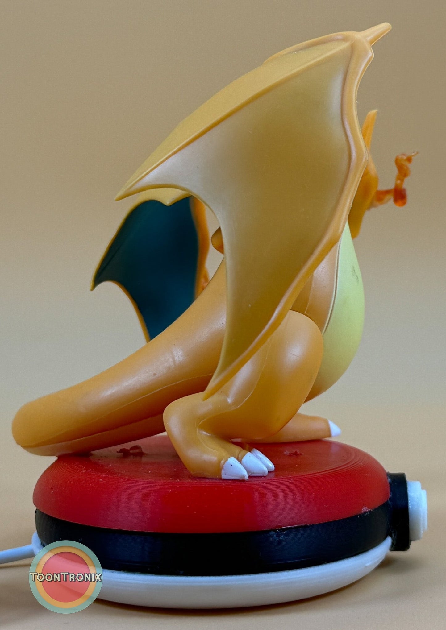4" Charizard Pokemon statue USB desk lamp with red and white base and built-in USB cord