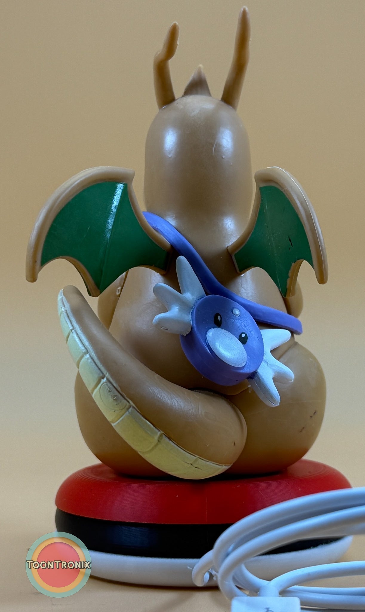 5" Dragonite Pokemon statue USB desk lamp with green wings and a blue Lapras figure on a red base with USB cord