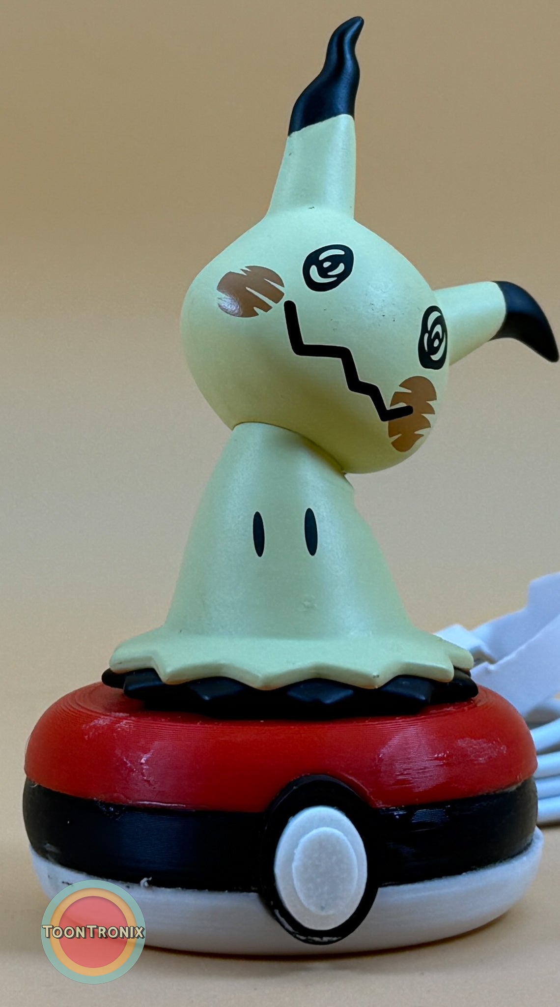 3" Mimikyu Pokemon statue USB desk lamp with built-in USB cord on a Pokeball base
