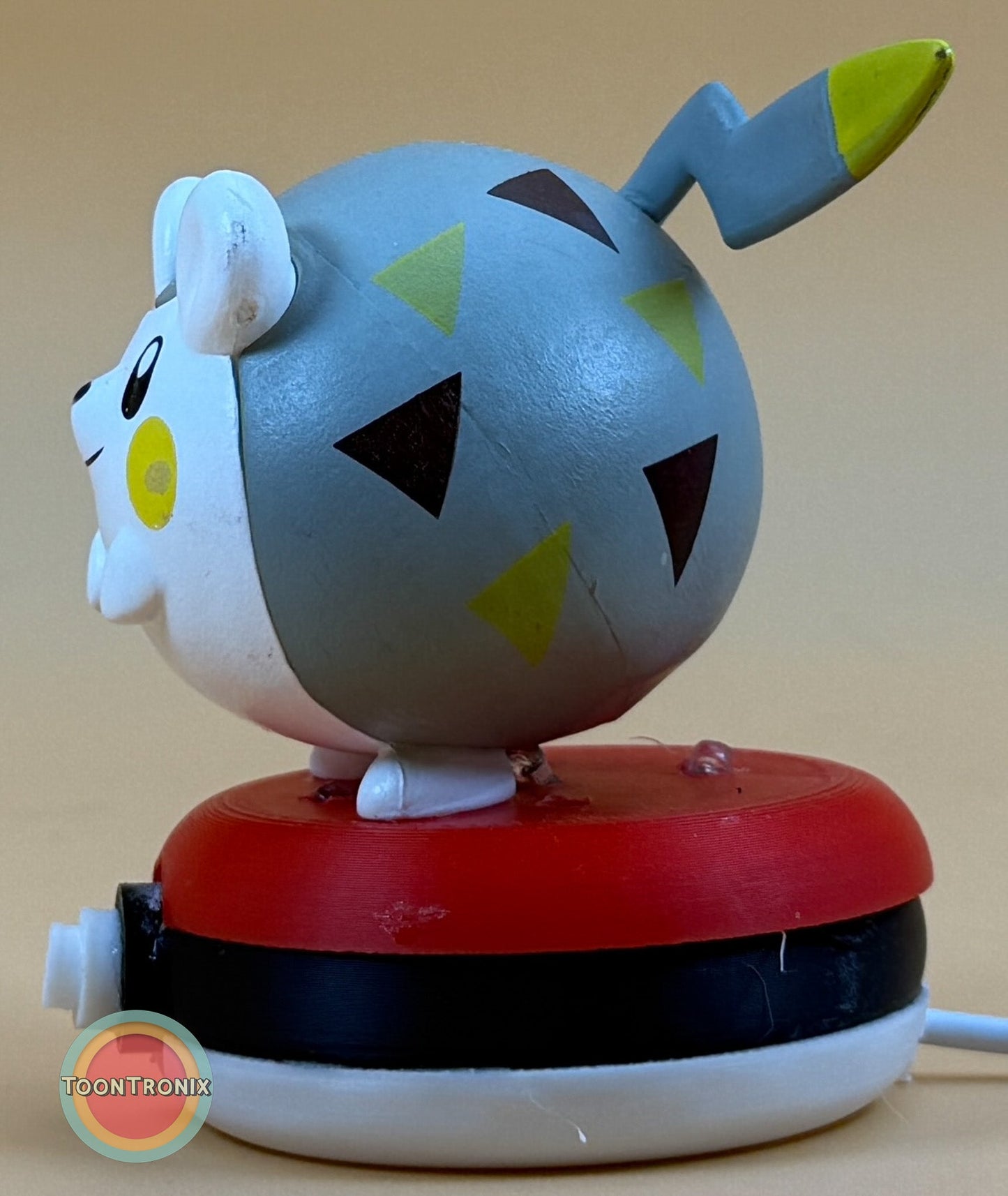 3" Togedemaru Pokemon statue USB desk lamp with colorful geometric pattern on a round red and black base.