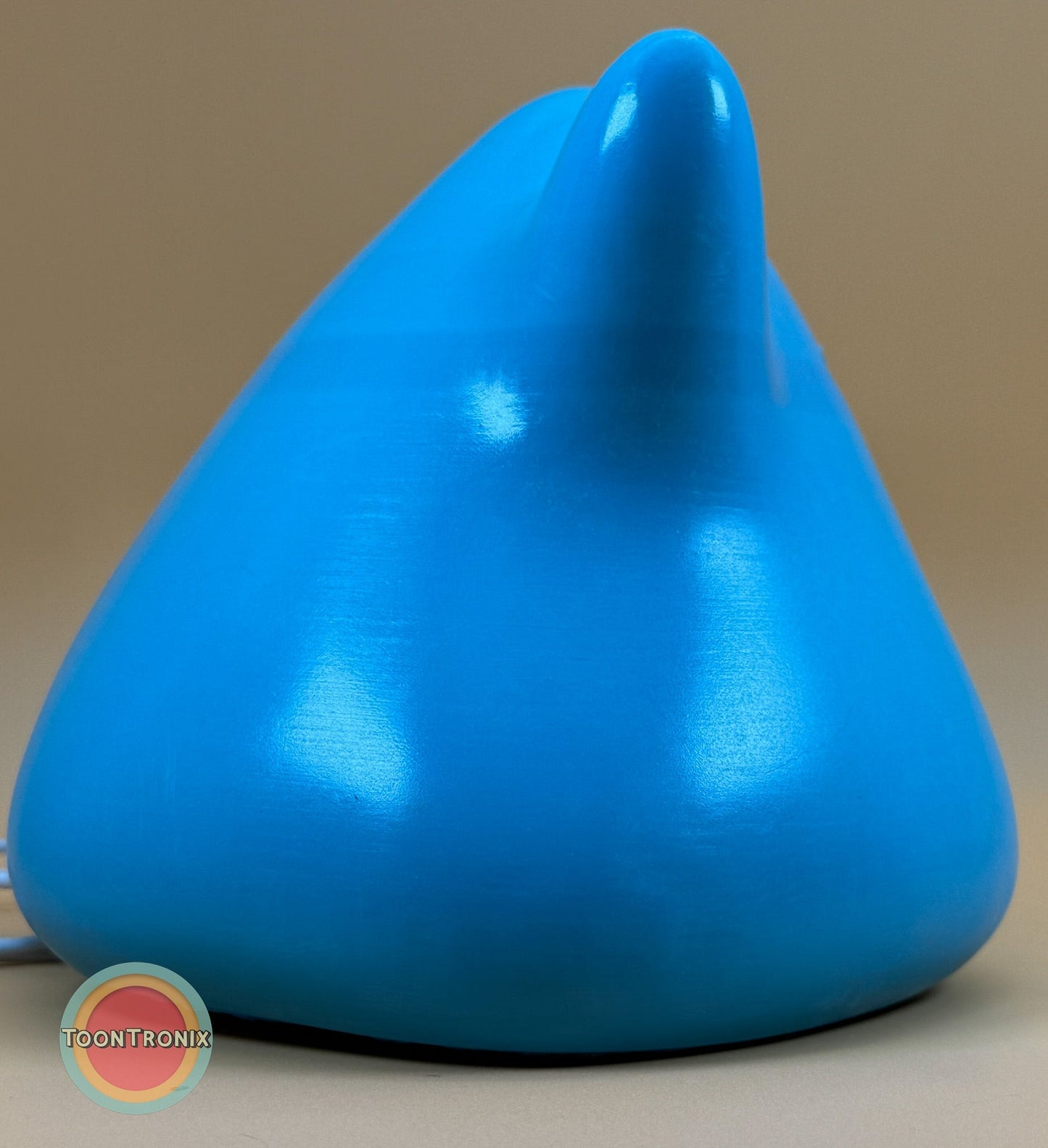 6" shiny blue Ditto Pokemon USB desk lamp with wood-like finish and production issue band across mouth