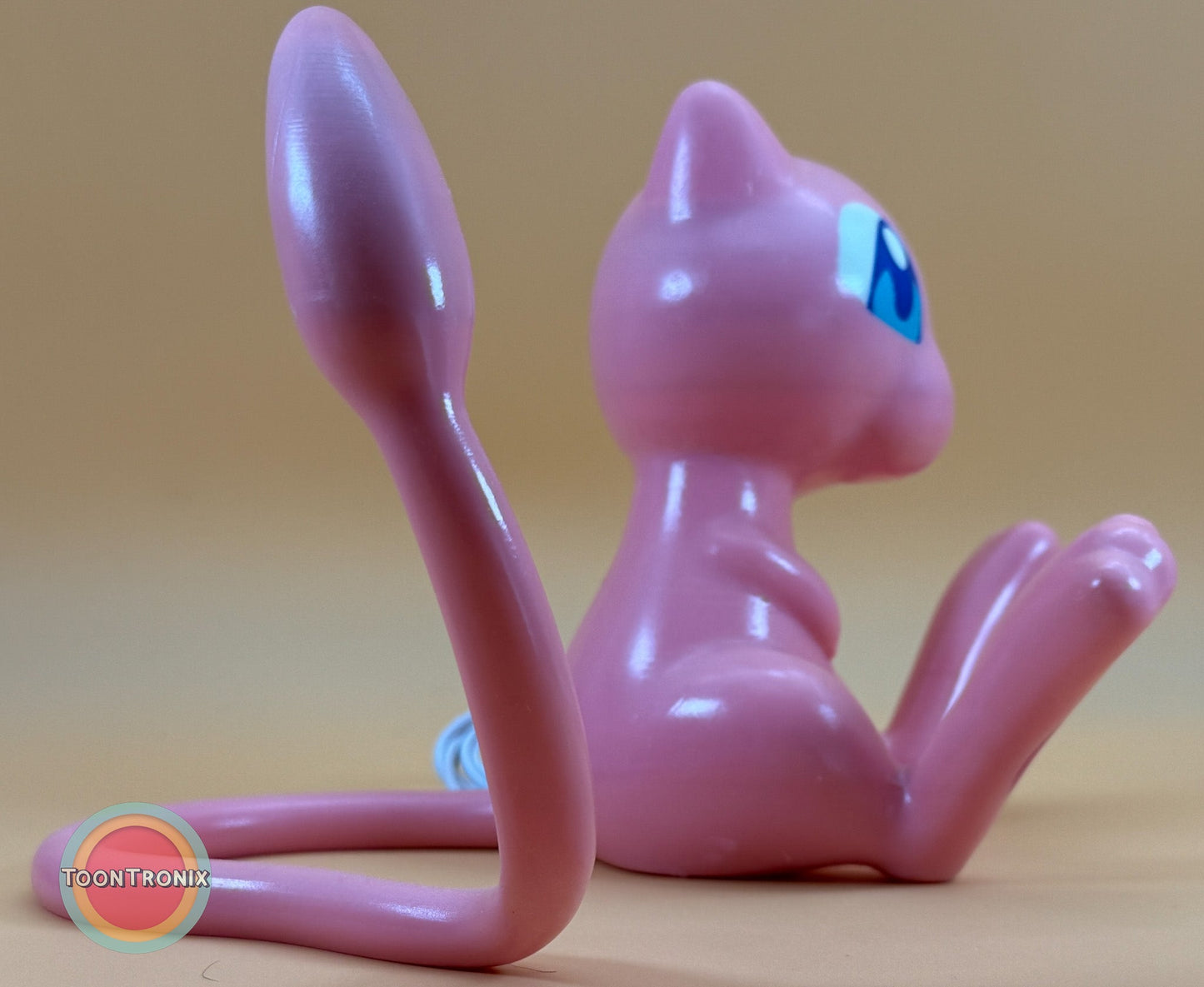 6-inch tall 11-inch wide pink Mew Pokemon USB desk lamp with wood-like finish sitting on a surface