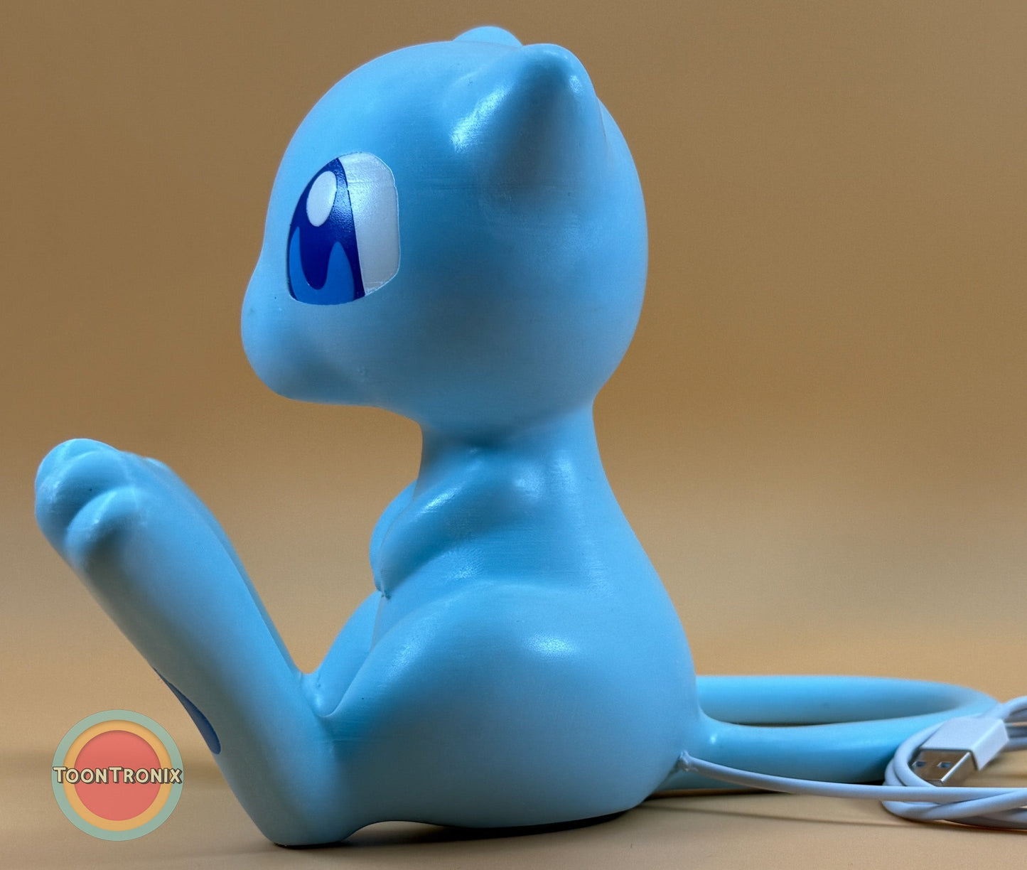 6 inch tall 11 inch wide shiny Mew Pokemon statue USB desk lamp with wood-like finish and built-in USB cord