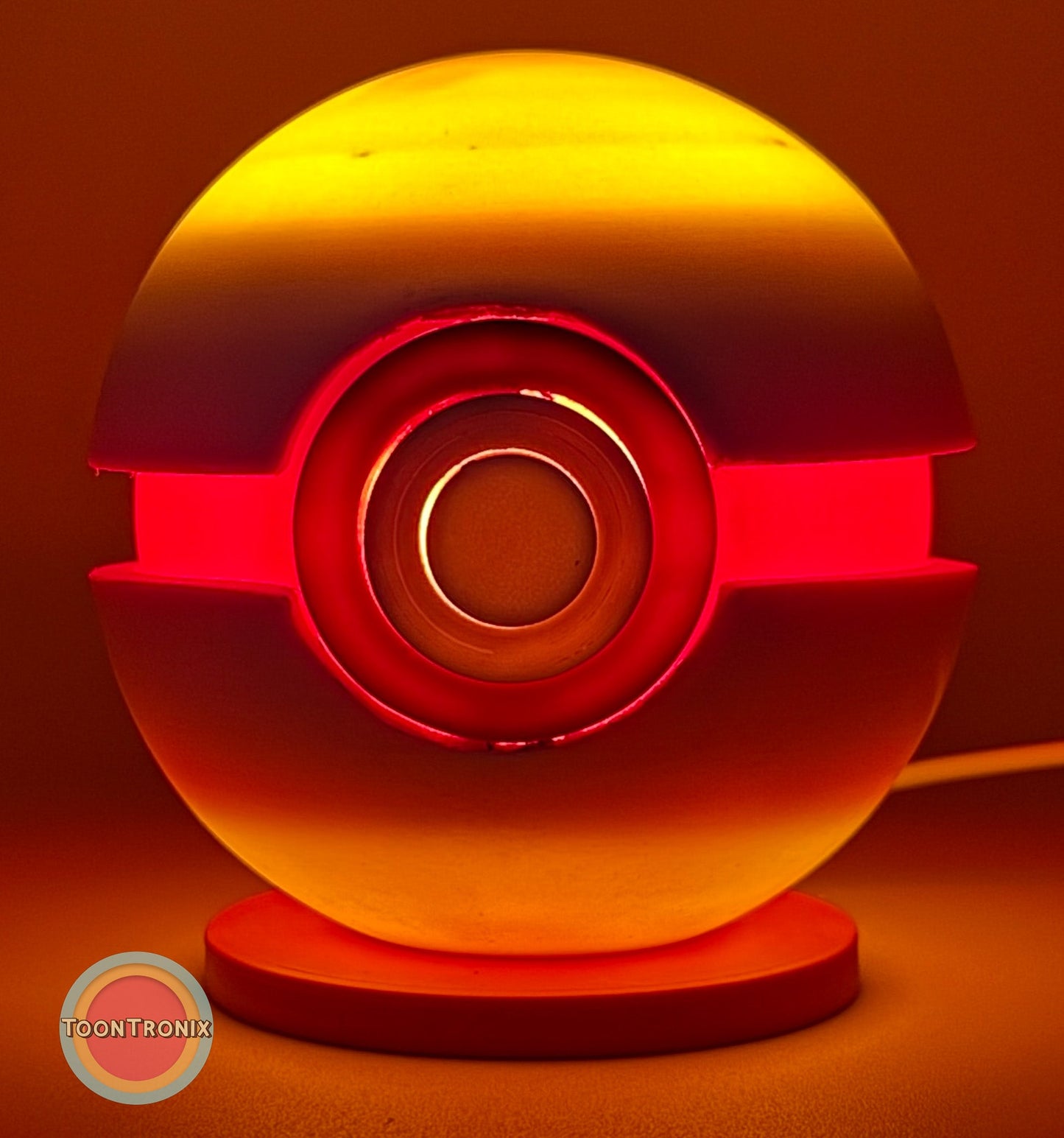 Glowing 4.5" Pokeball Premier Ball USB desk lamp with wood-like finish