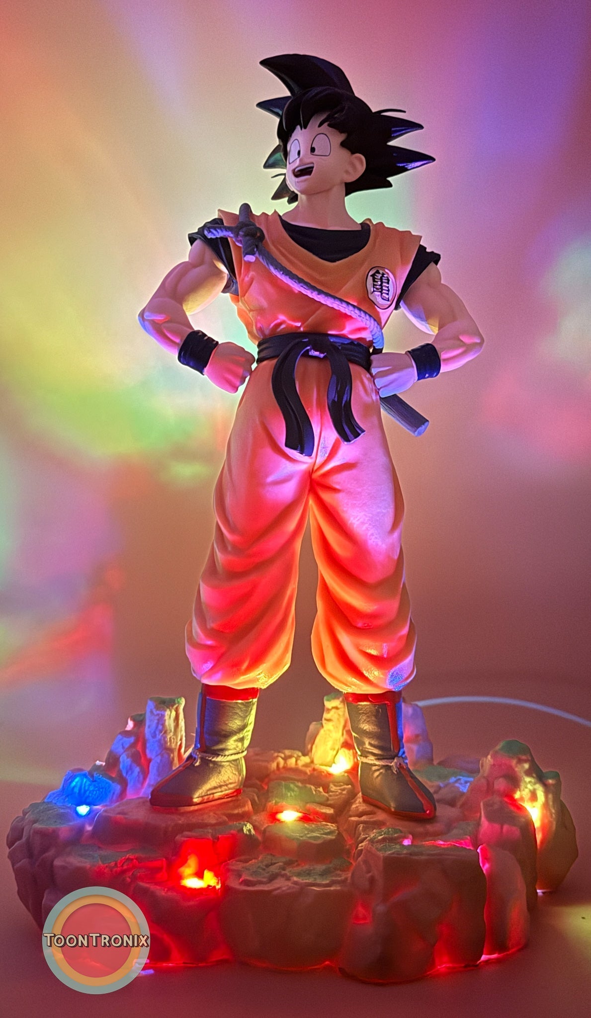 12" 1 FT Goku Statue USB desk lamp glowing with colorful lights on rocky base