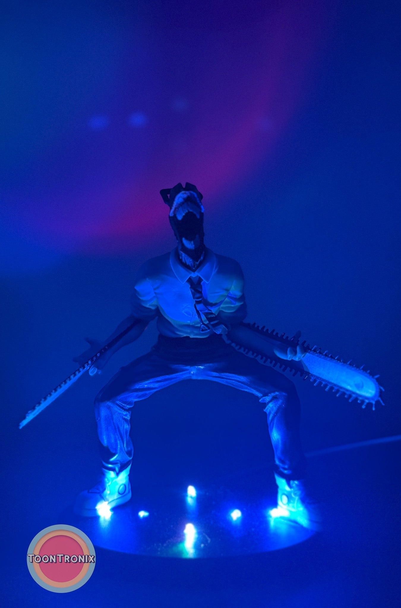 5" Chainsaw Man statue USB desk lamp glowing with blue light and chainsaw arms in dynamic pose