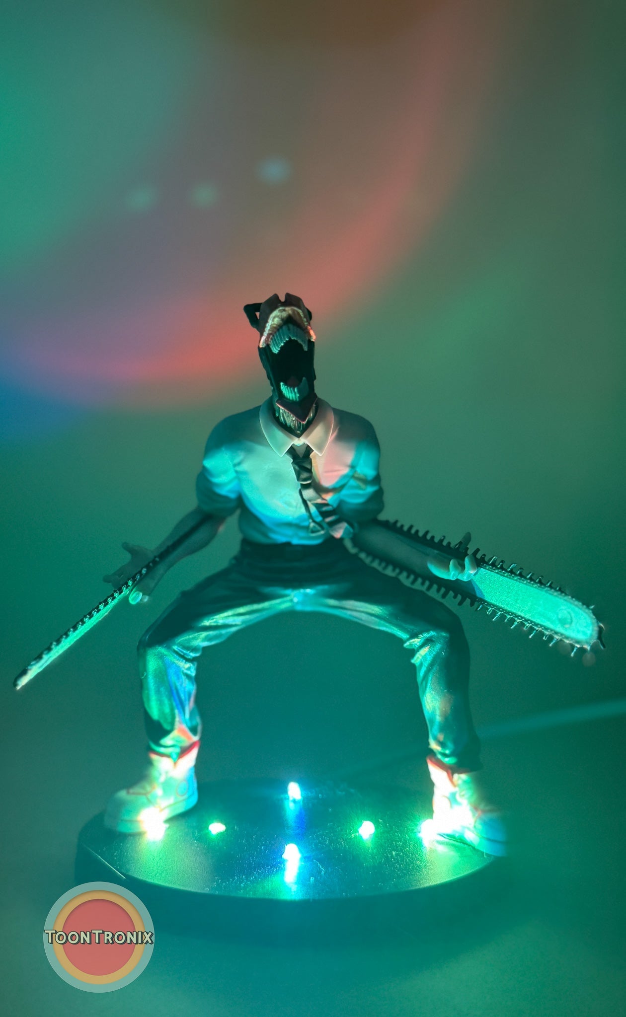5" Chainsaw Man statue USB desk lamp glowing with colorful lights on round base