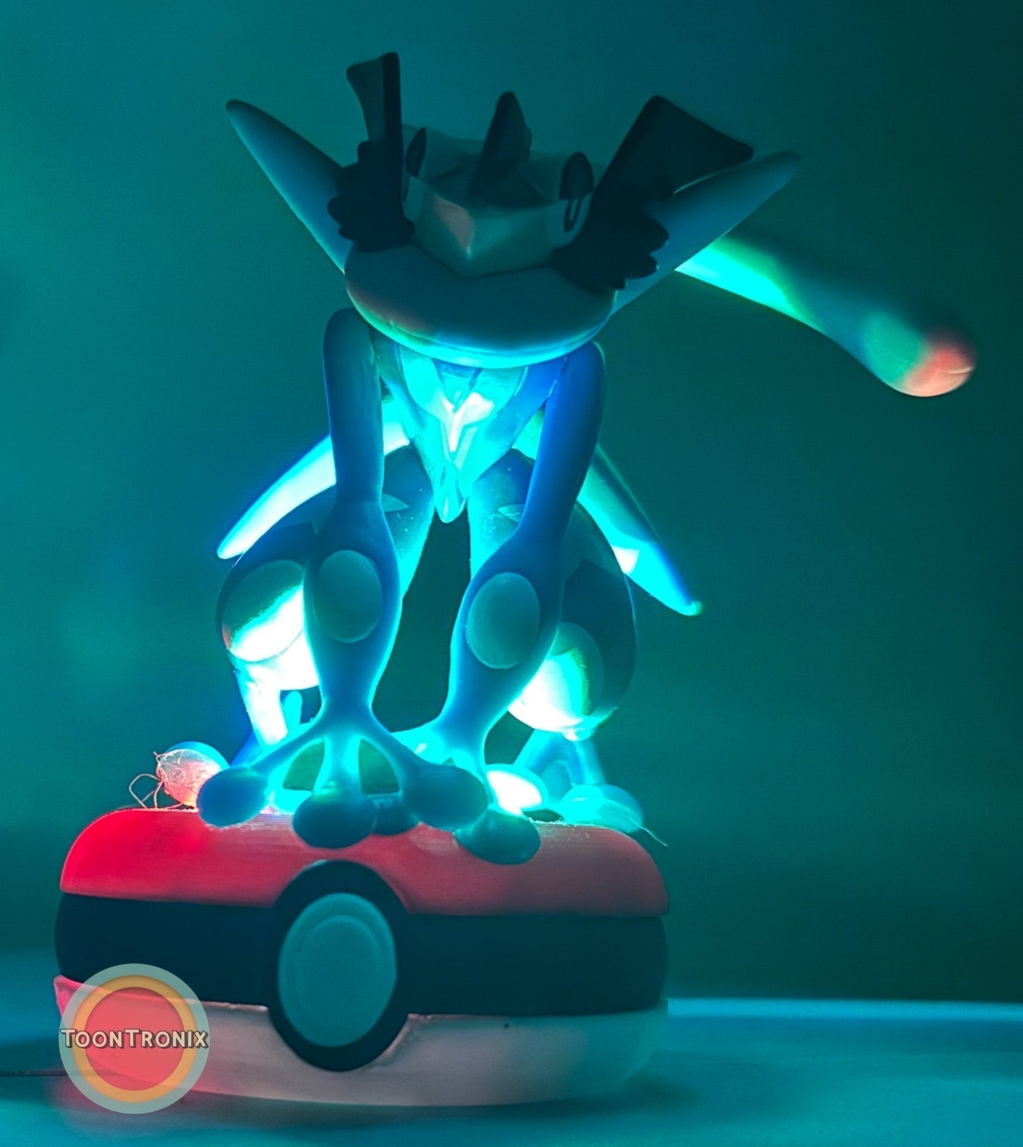 3" Greninja Pokémon statue USB desk lamp glowing blue on Poké Ball base