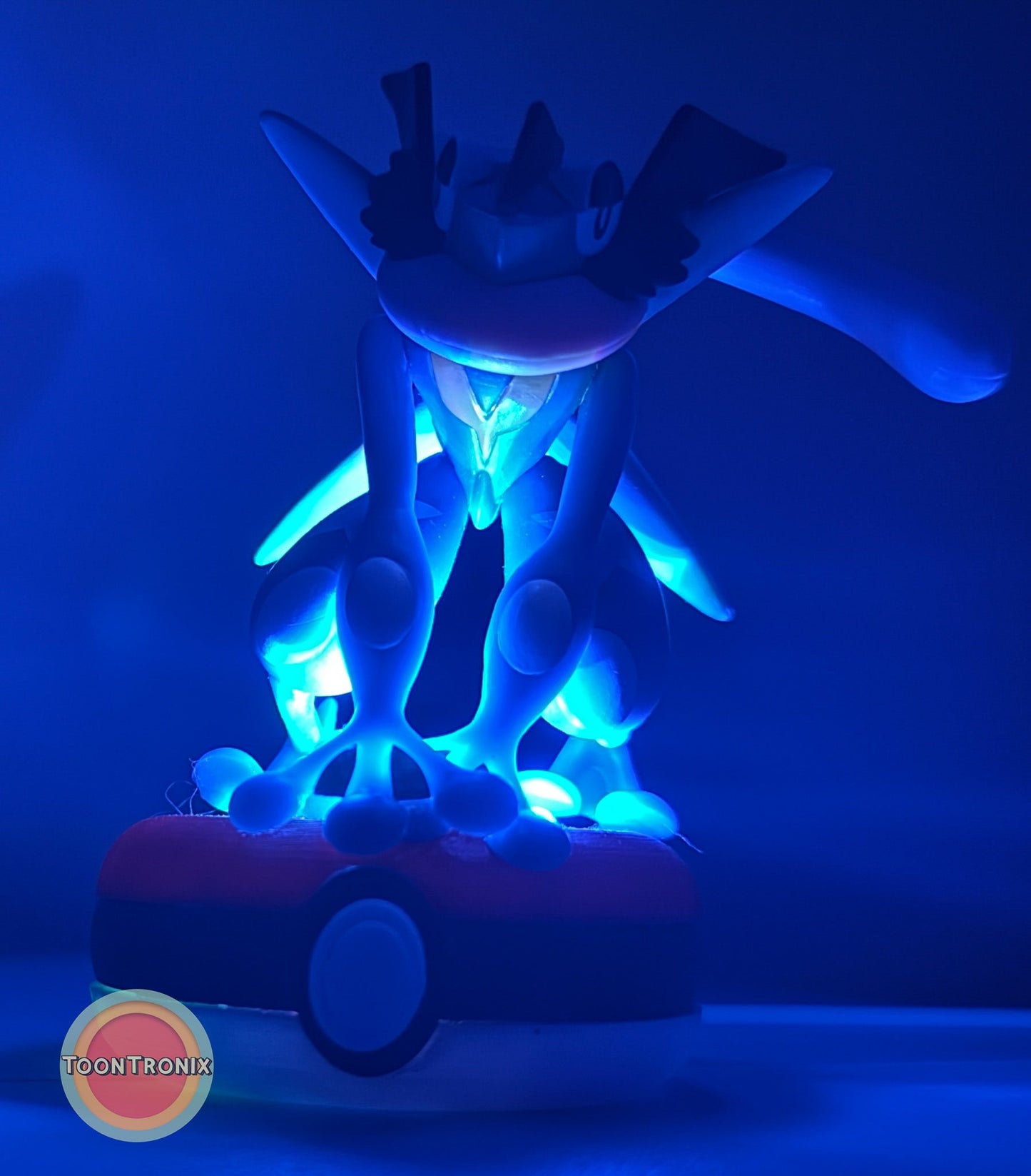 3" Greninja Pokémon USB desk lamp glowing blue on Pokeball base