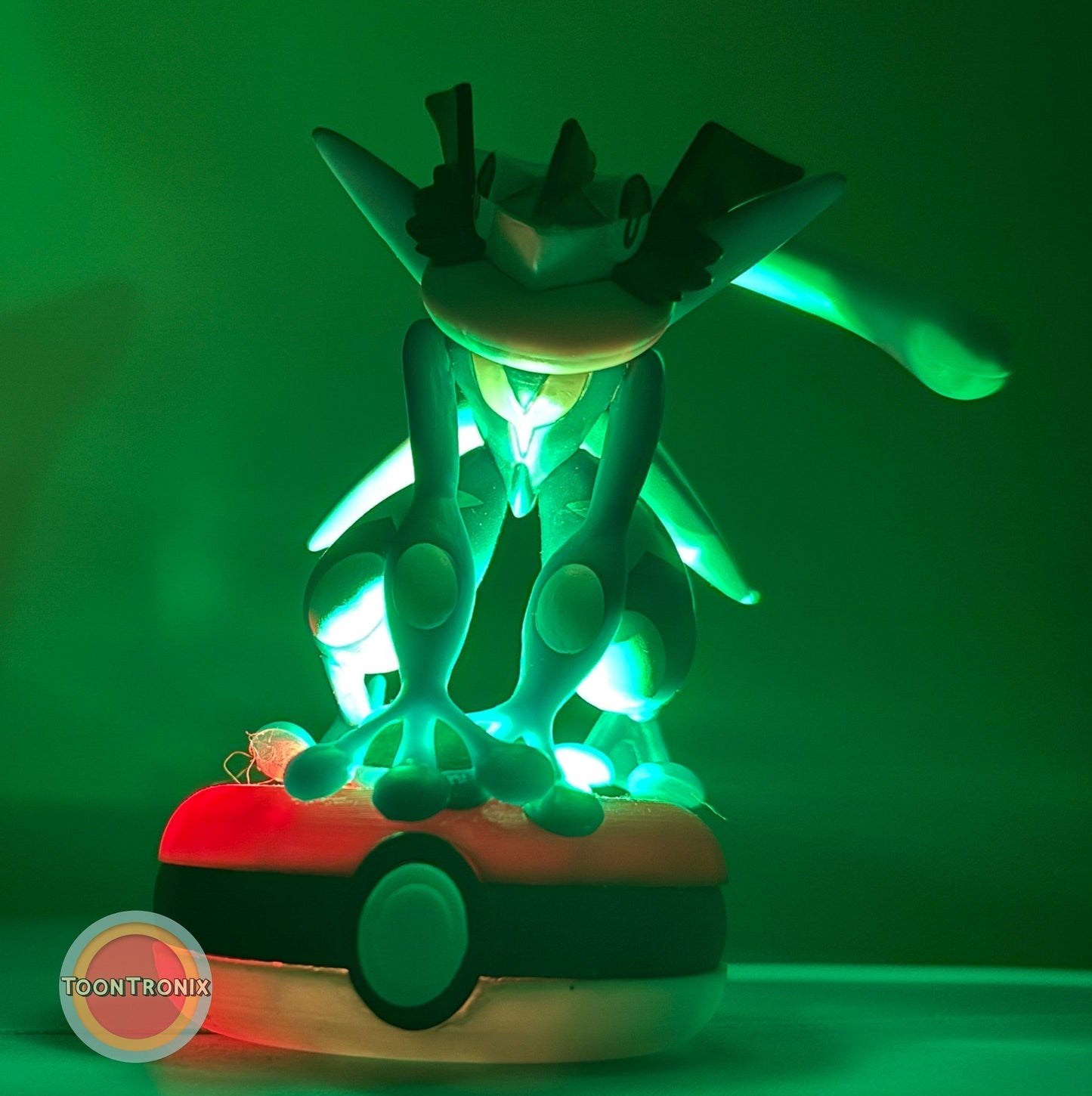 3" Greninja Pokémon statue USB desk lamp glowing green on Poké Ball base