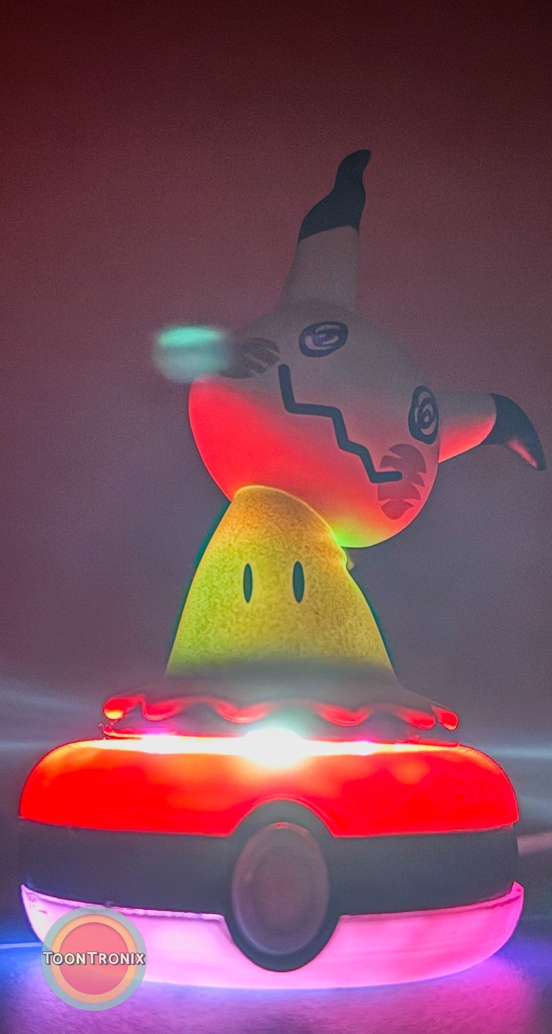 3" Mimikyu Pokemon Statue USB desk lamp glowing with colorful lights on Pokeball base
