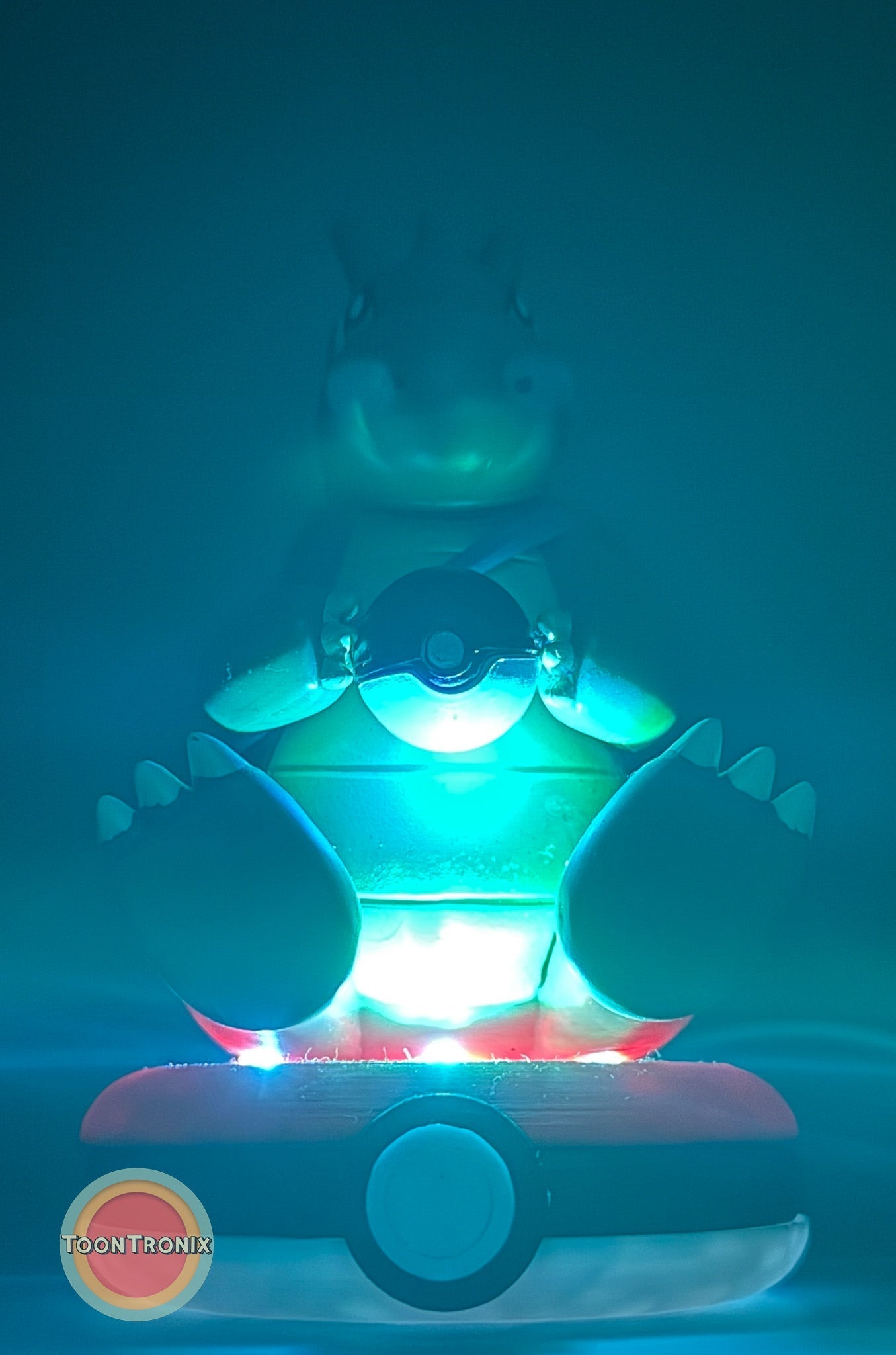5" Dragonite Pokemon Statue USB desk lamp glowing with blue and red light on a Pokeball base