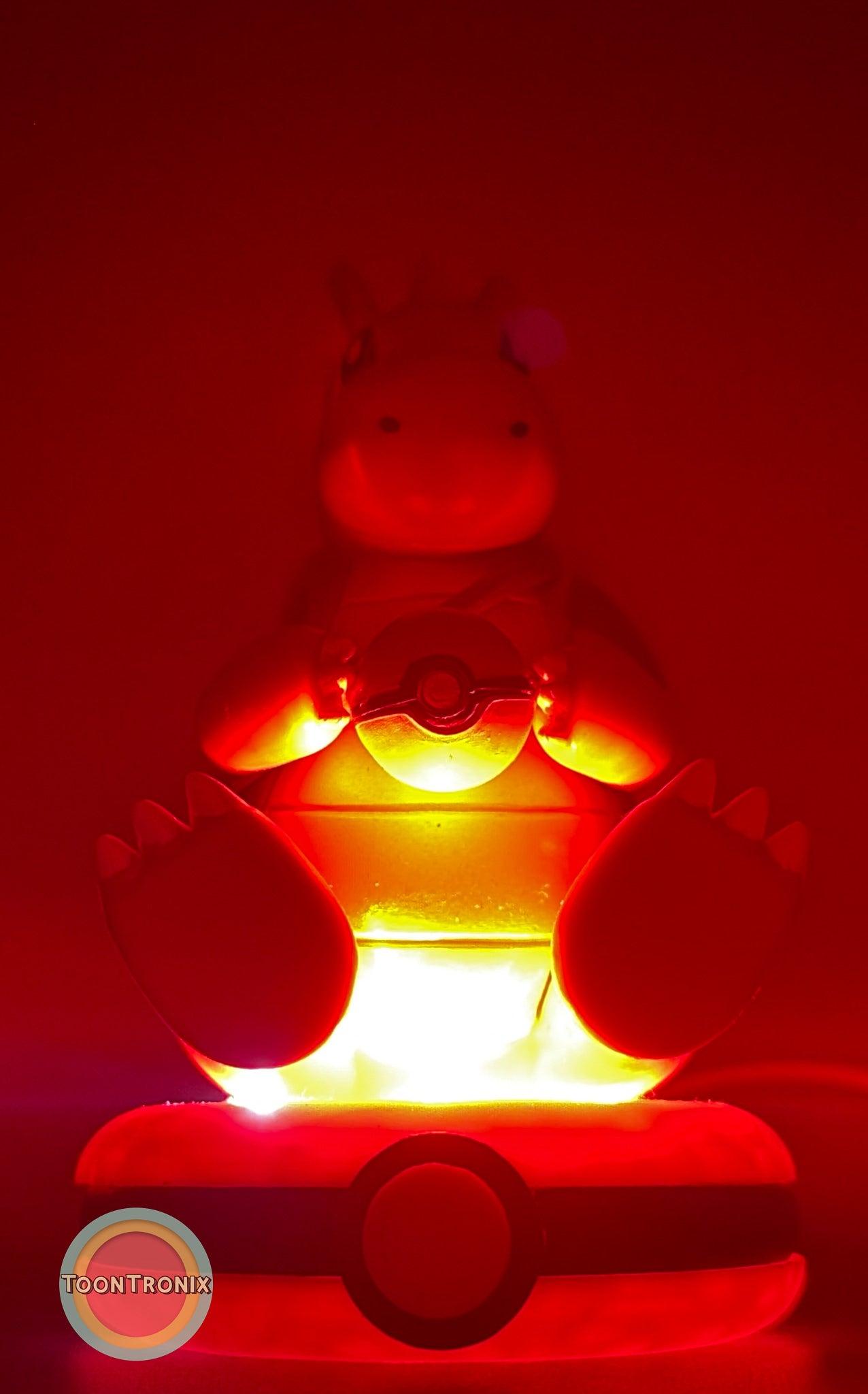5" Dragonite Pokemon statue USB desk lamp glowing red on Pokeball base