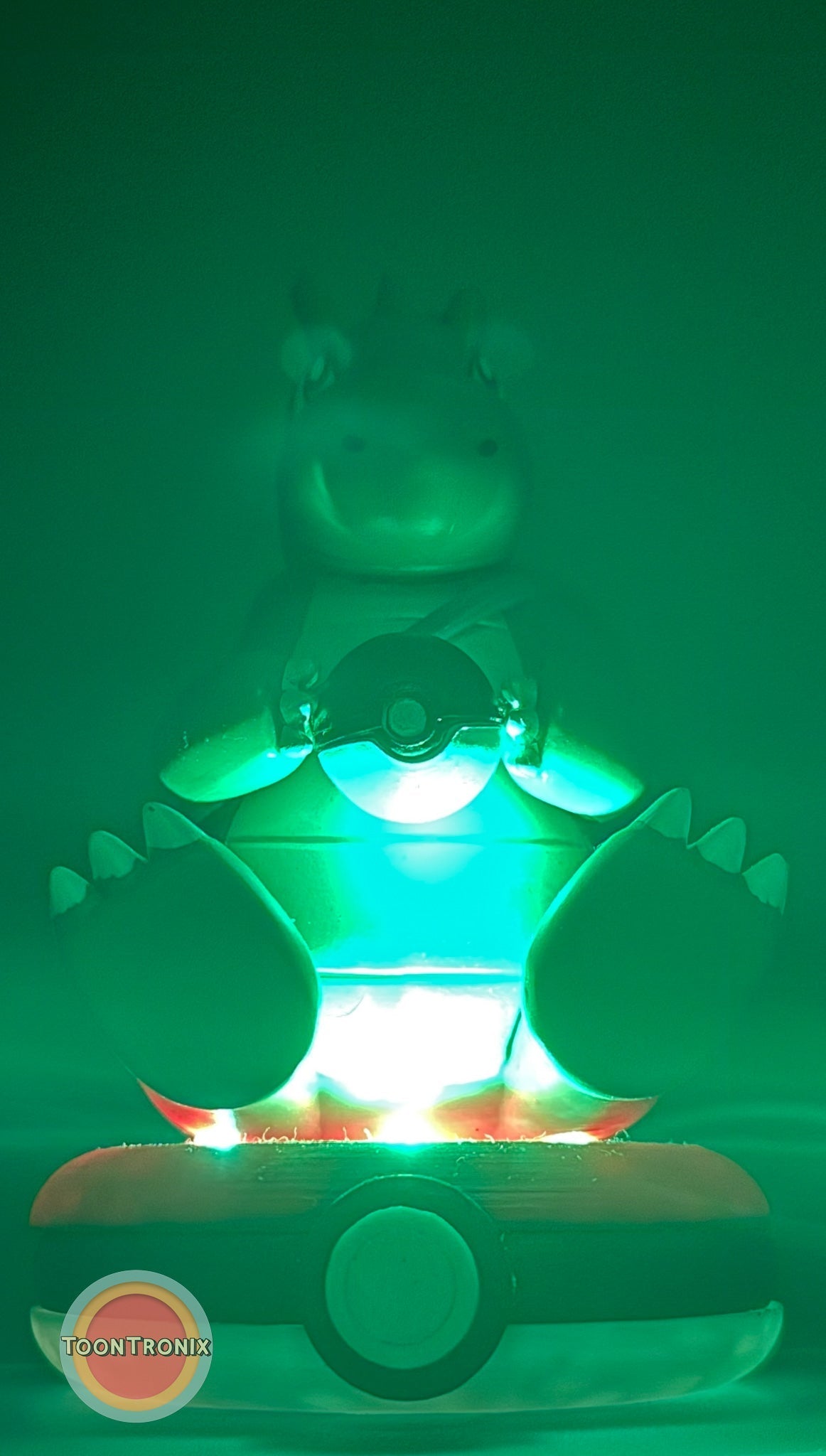 5" Dragonite Pokemon statue USB desk lamp glowing green on a Pokeball base