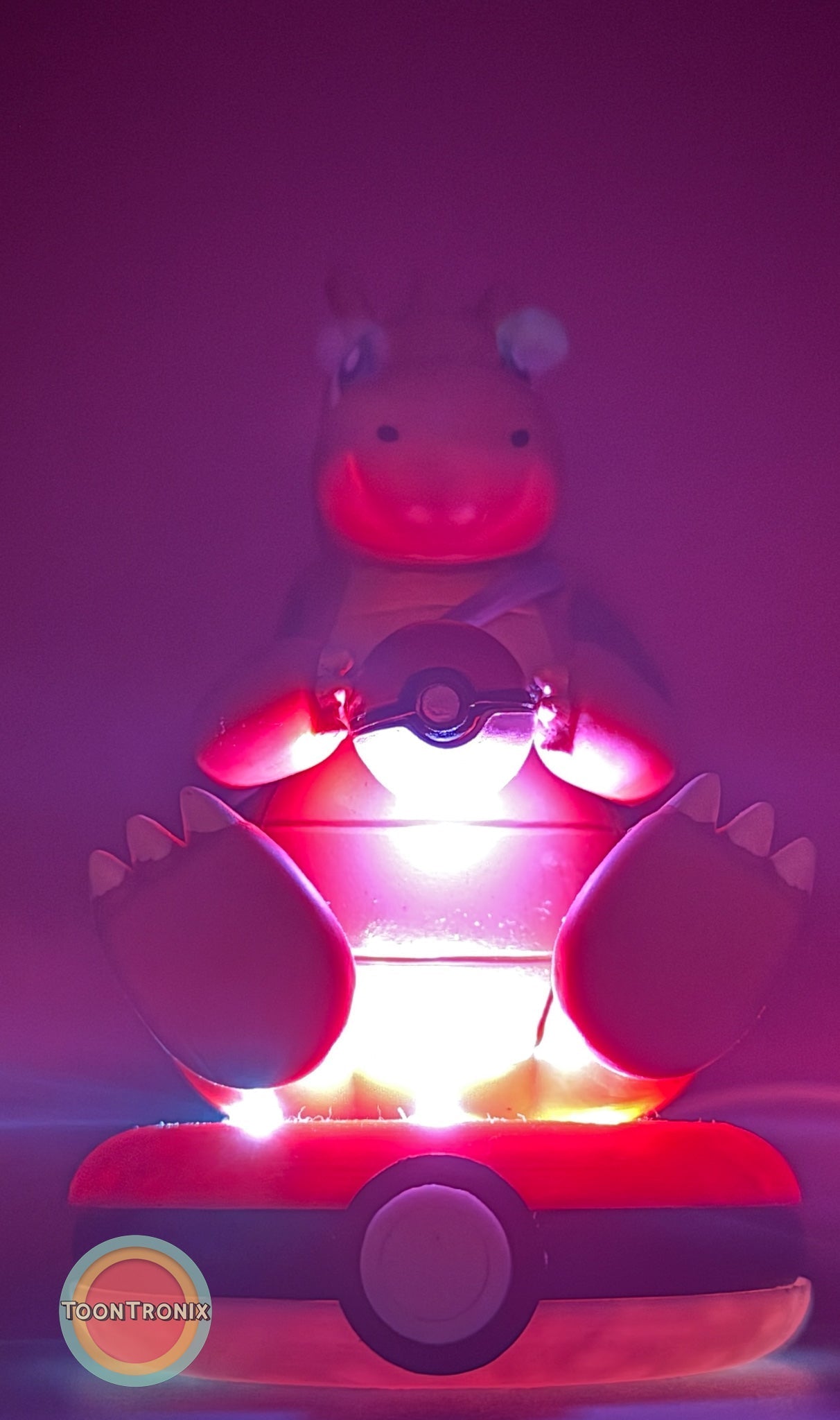 5" Dragonite Pokemon statue USB desk lamp glowing pink on Pokeball base